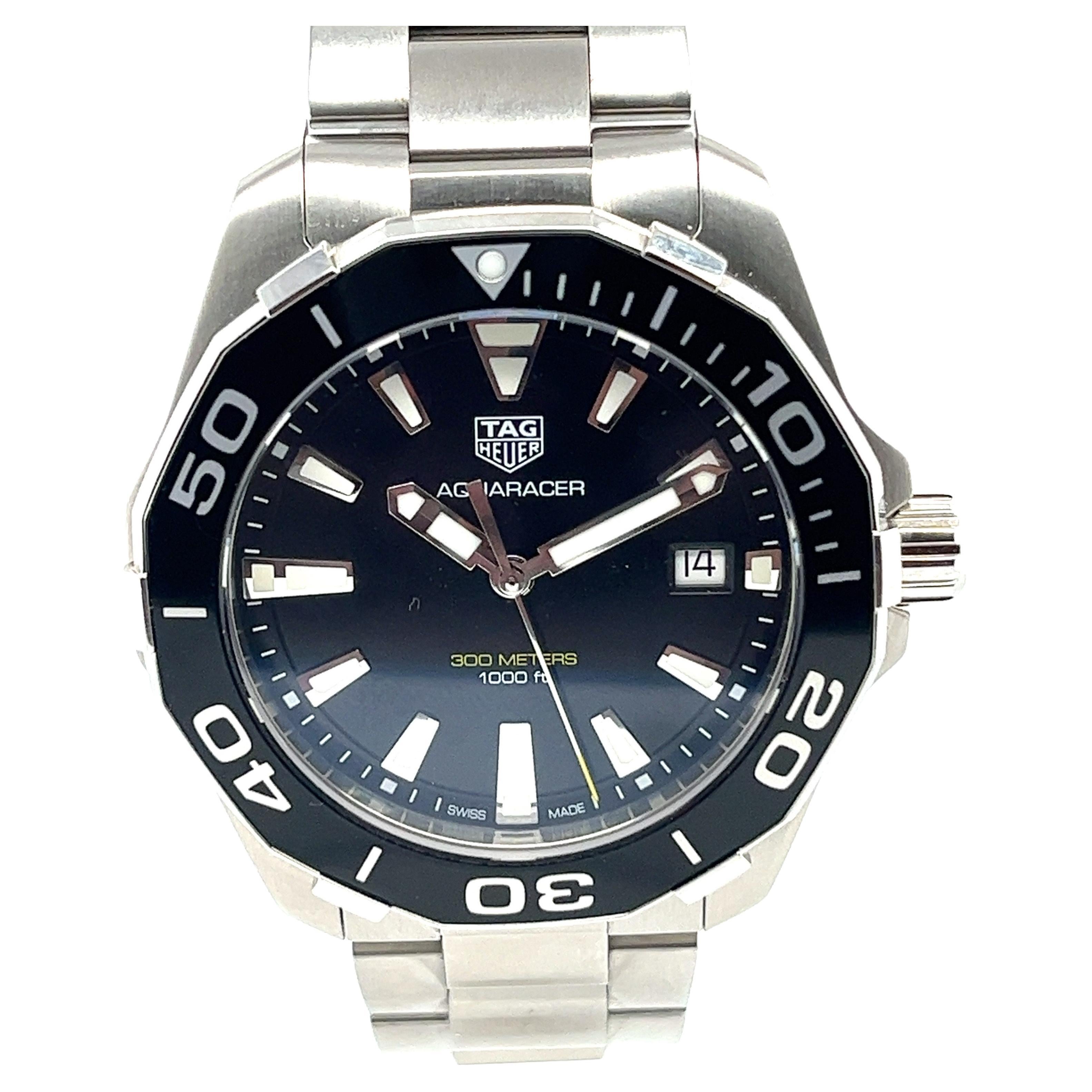 This beautiful Tag Heuer Aquaracer is in pristine condition. A quartz men's watch that features a black dial, black aluminium bezel and a polished stainless steel case. Good for up to 300 metres or 1000 feet underwater it is designed for the depths.