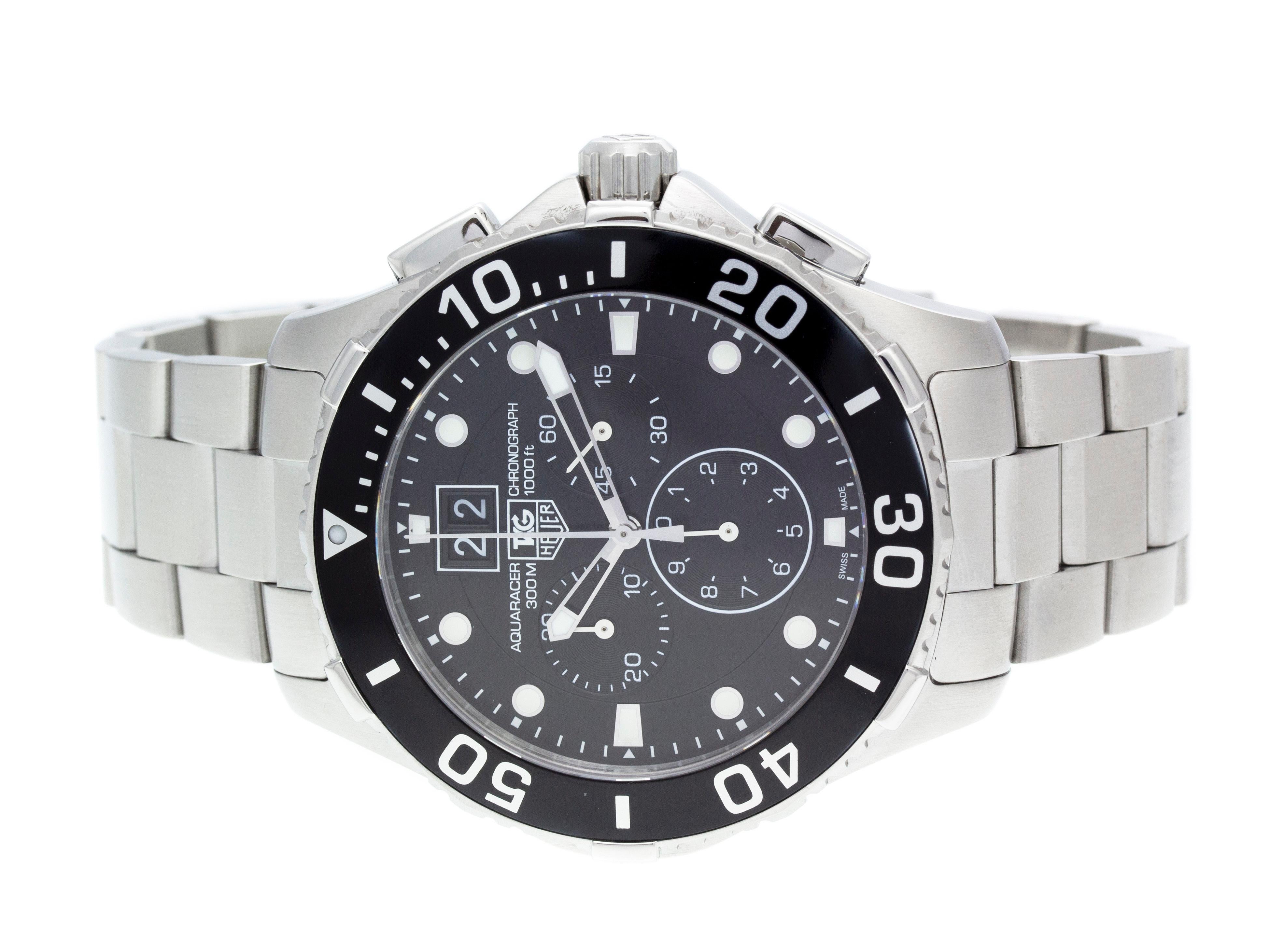 Stainless steel Tag Heuer Aquaracer Grande quartz watch with a 43mm case, black dial, and steel braclelet with folding clasp. Features include hours, minutes, seconds, grand date, and chronograph. Comes with a Deluxe Gift Box and 2 Year Store