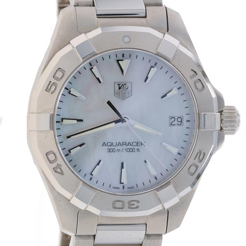 Brand: Tag Heuer
Model: Aquaracer
Model Number: WWF6796
Movement: Quartz
Number of Jewels: 5
Warranty: One Year
Movement Maker: Swiss
Dial Color: White Mother of Pearl

Metal Content: Stainless Steel

Fastening Type: Deployment Clasp
Features: