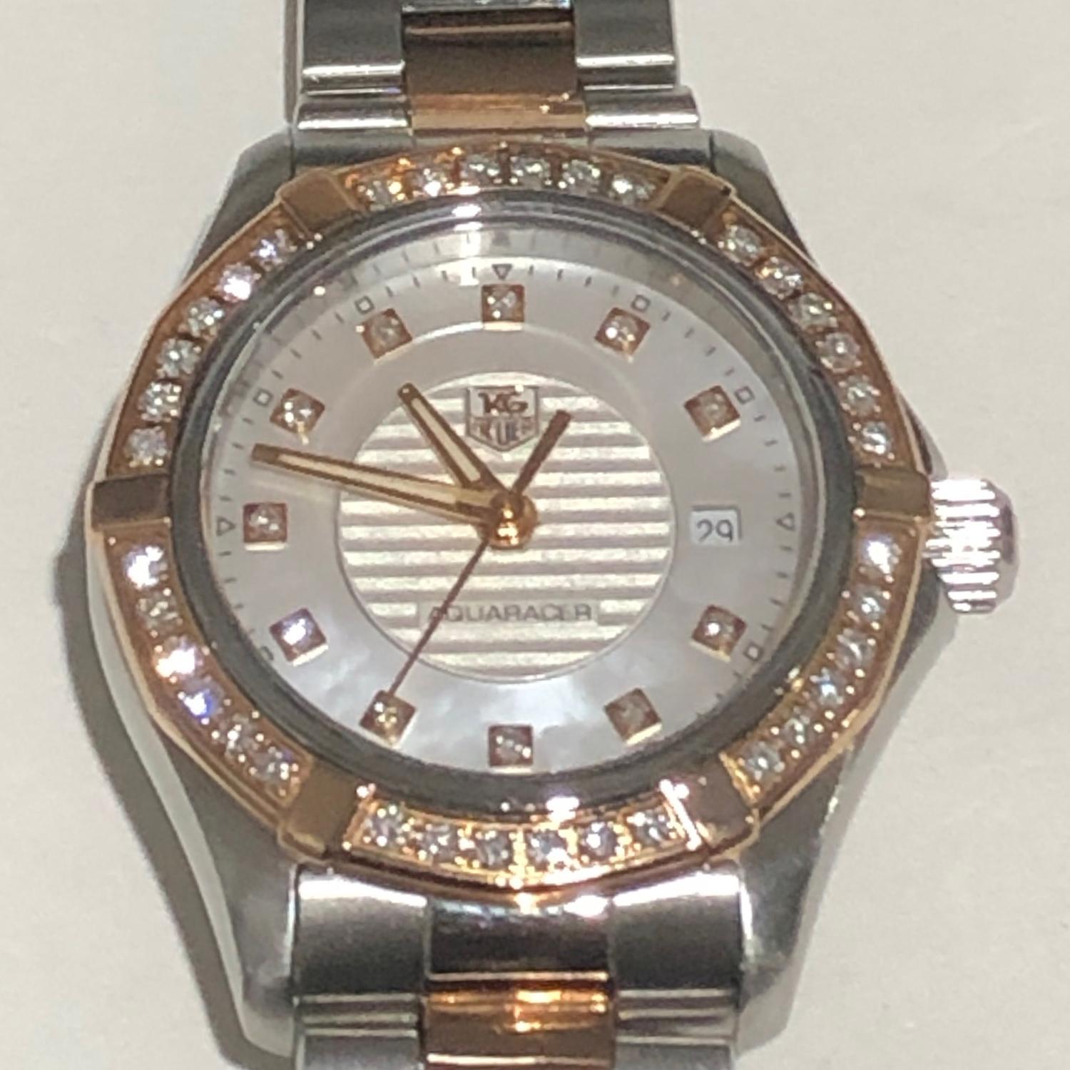 Tag Heuer Aquaracer Quartz Rose Gold & Steel Ladies WAP1452.BD0837 - Quartz . Steel and Rose Gold with diamond bezel ( 27 mm) 36 diamonds weighing.383 cts . White dial with 11 diamonds weighing .070 cts. Steel and Rose gold bracelet; will fit up to