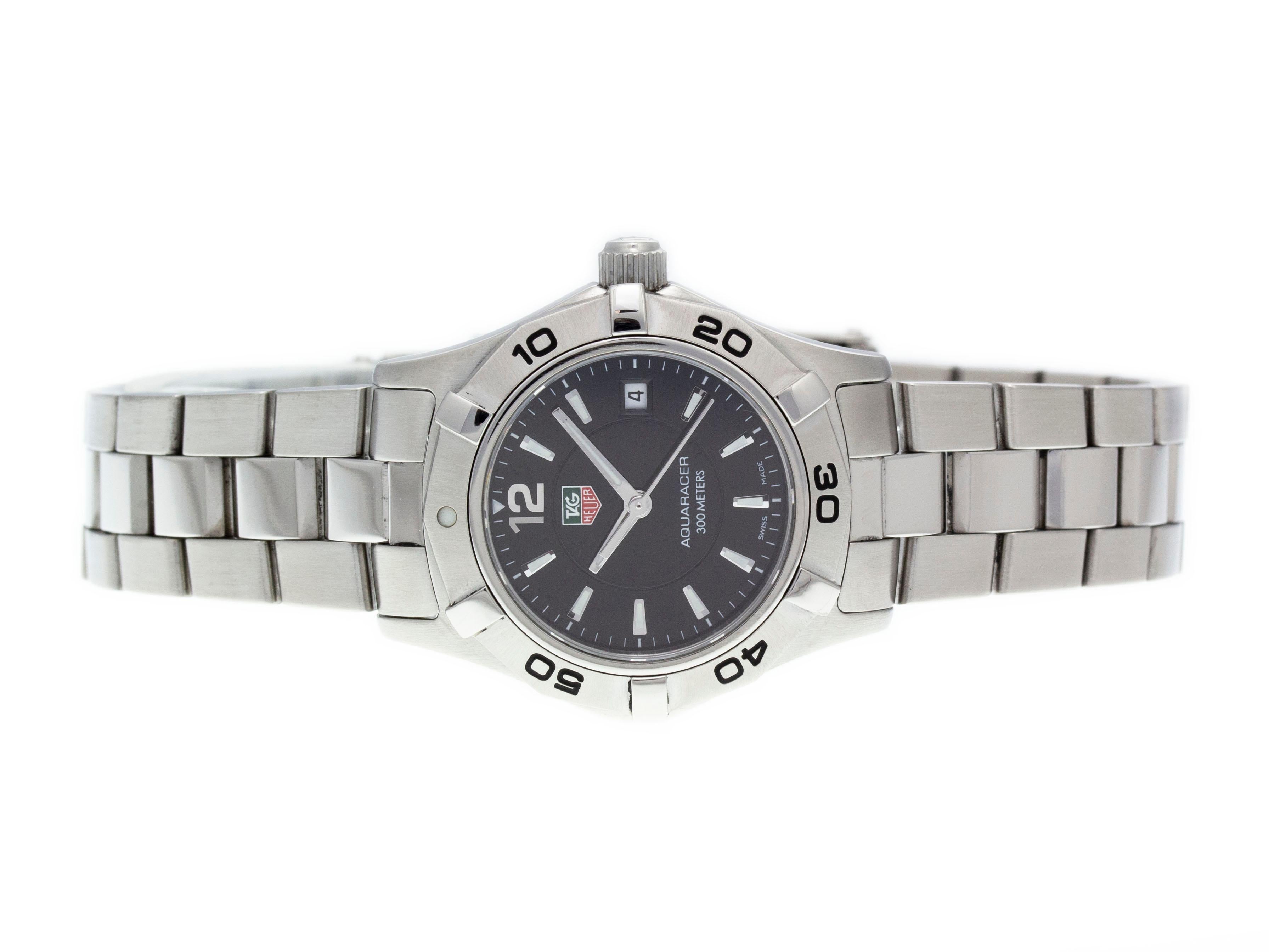 Stainless steel Tag Heuer Aquaracer quartz watch with a 27mm case, black dial, and bracelet with folding clasp. Features include hours, minutes, seconds and date. Comes with a Tag Box and 2 Year Store Warranty.​

Brand	Tag