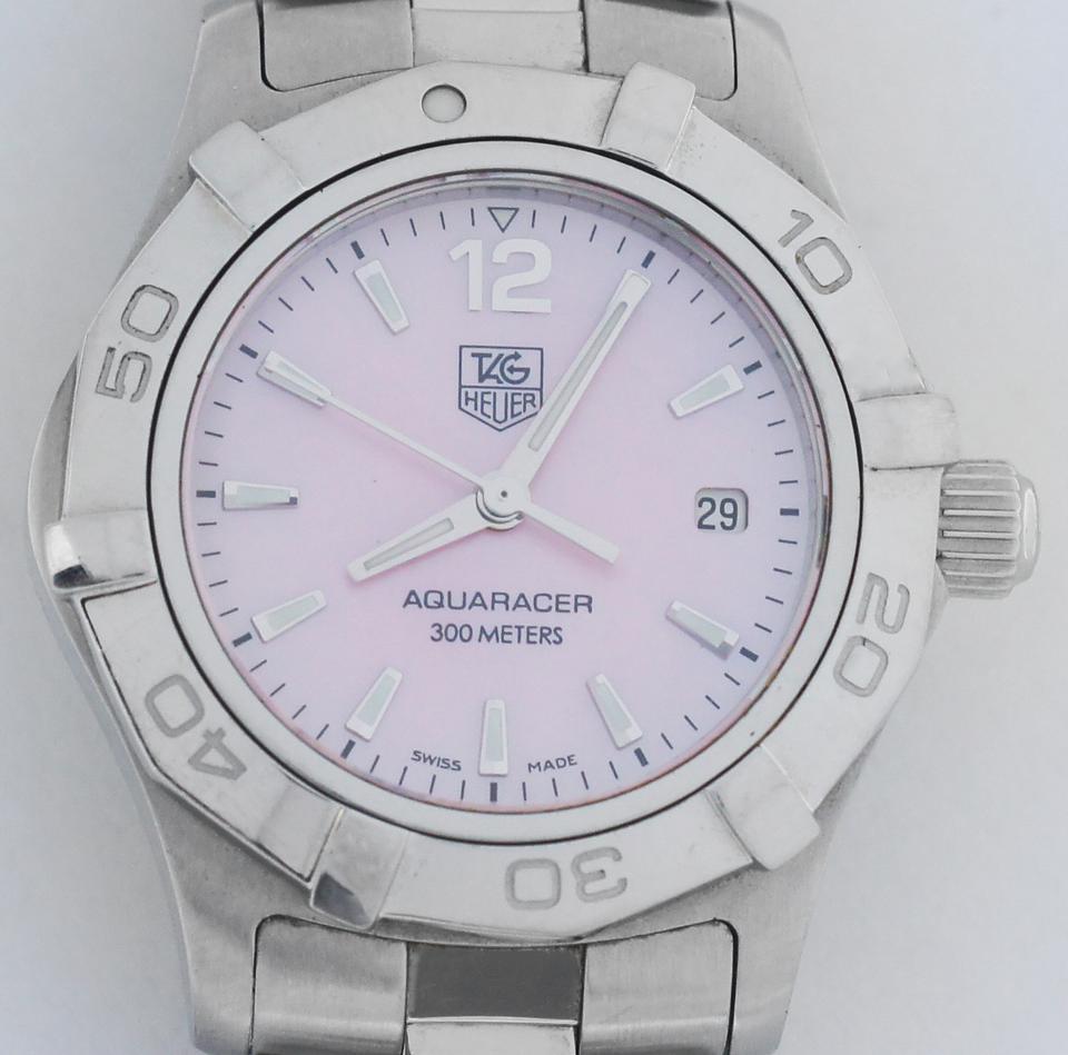 The TAG Heuer Aquaracer Waf1418 
Stainless Steel Case and bracelet 
Pink MOP Dial 
Date display at the 3 o'clock position. 
It has a unidirectional bezel
CASE SIZE 28 mm
double locking clasp
water resistant up to 300 meters
It also has a scratch