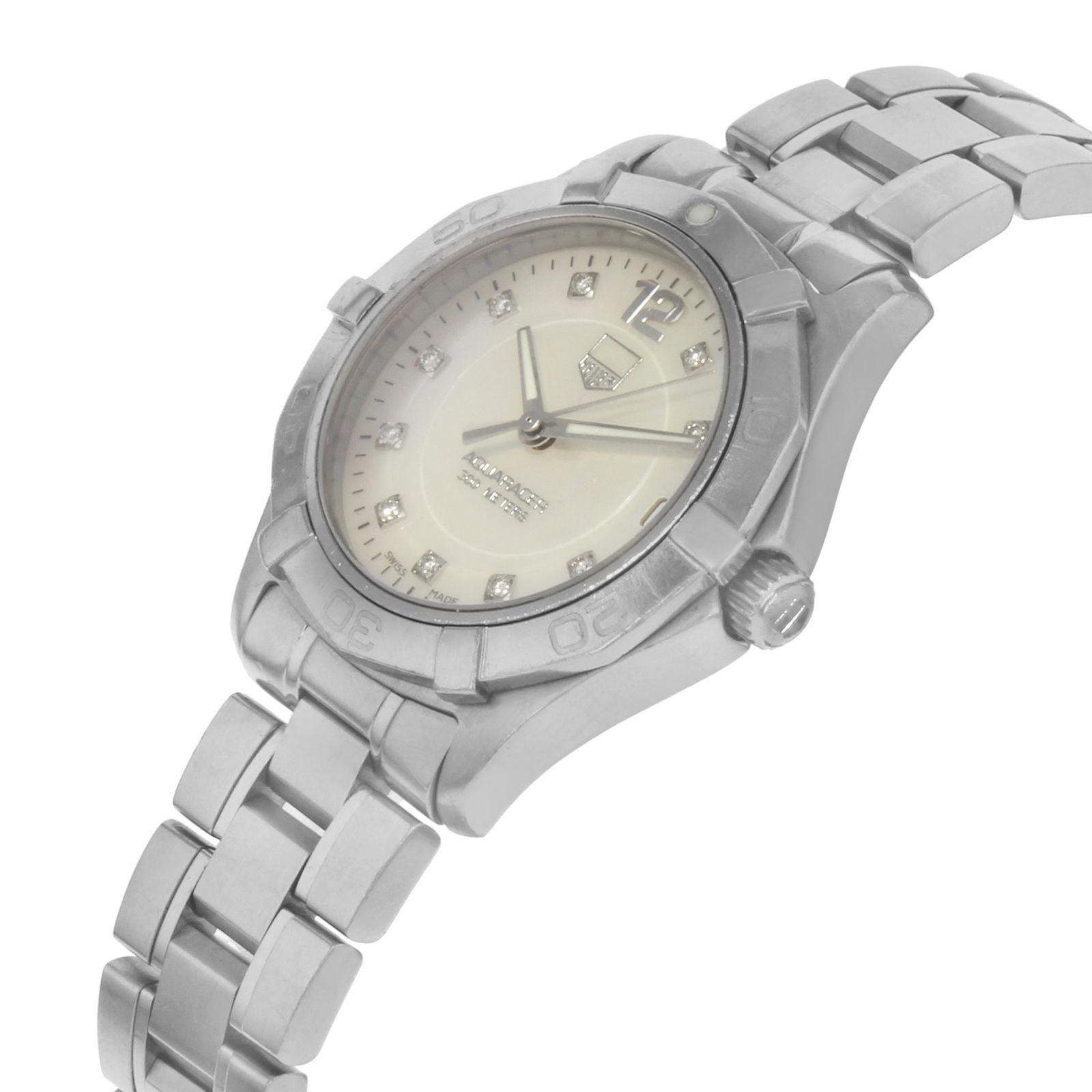 Pre-owned. The face of this watch has a 'tag' logo missing from the dial. 

Details:
Brand	TAG Heuer
Series	Aquaracer
Model Number	WAF1312.BA0817
Box	No
Papers	No
Movement	Quartz: Battery
Gender	Ladies
Case Material	Stainless Steel
Case