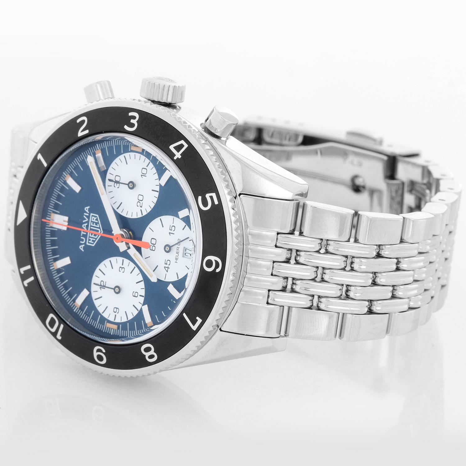 TAG Heuer Autavia Limited Edition Watches of Switzerland Mens Watch - Automatic Chronograph with Date. Stainless Steel case with black aluminum bezel ( 42 mm ). Blue sunray dial with date window at 6 o'clock. 7 Row Grains of Rice bracelet; will fit