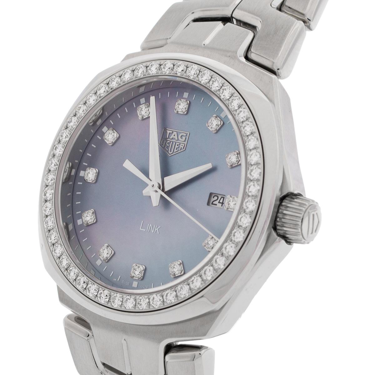 This Tag Heuer Link watch is made using stainless steel, detailed with diamonds on the bezel, and comes with a mother of pearl dial. The watch has added functions of date and 100 meters of water resistance.

Includes: Info Booklet, 5 Extra Links,