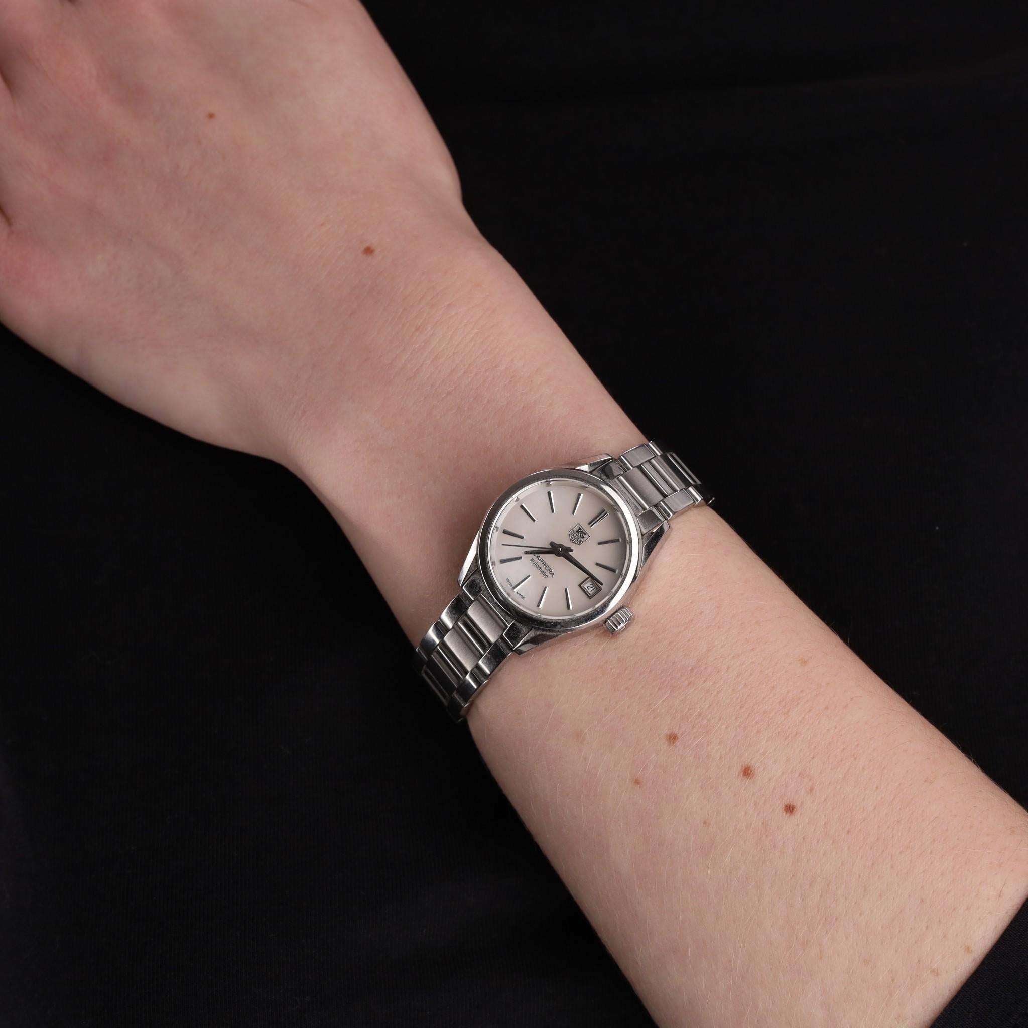 Tag Heuer Carrera Date Steel Watch With Mother-Of-Pearl Dial

Classic piece in silver, polished stainless steel case and bracelet with white mother-of-pearl dial.

AG Heuer logo to the centre, stick hour markers and date display at 3
