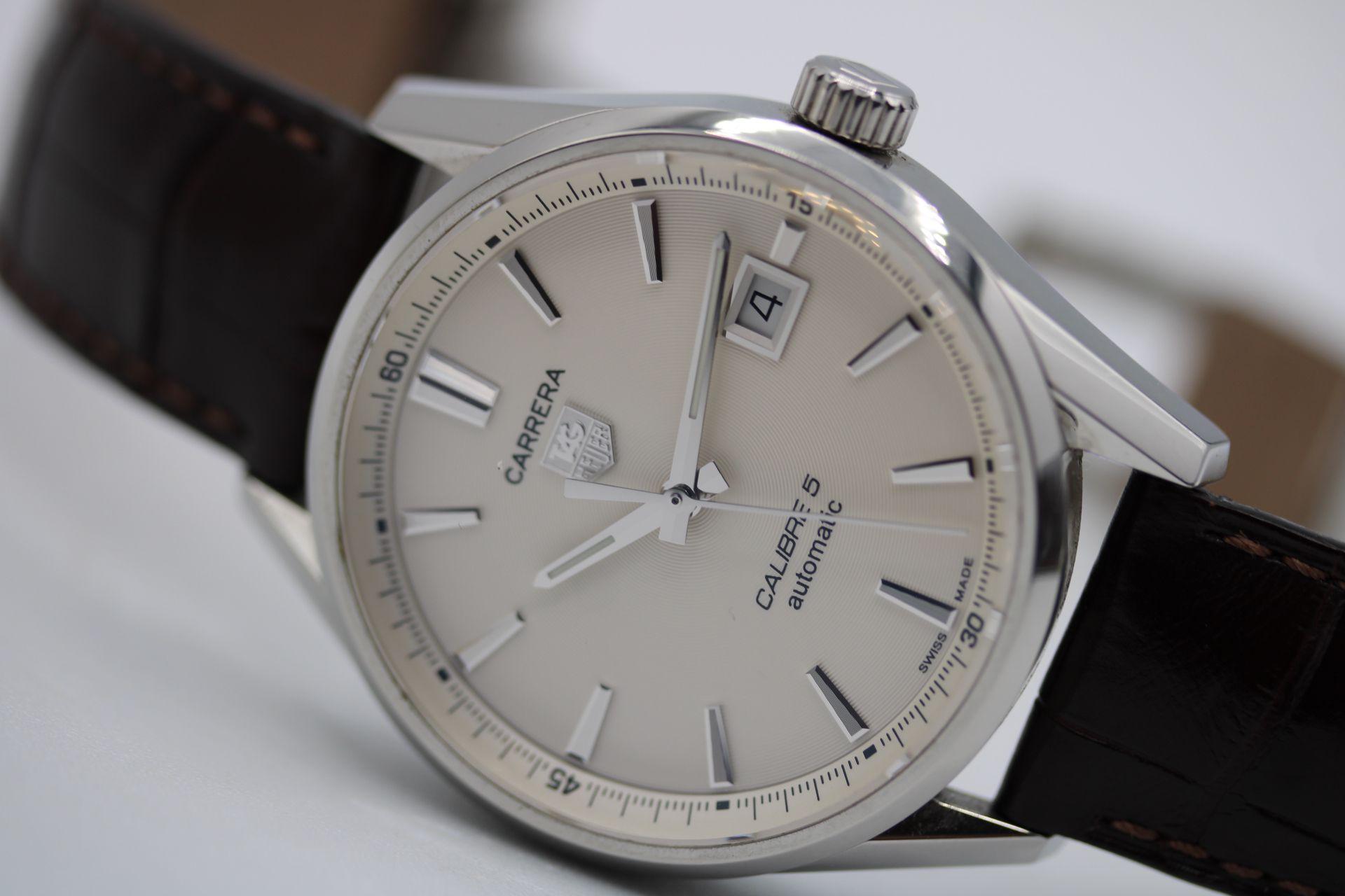 We are delighted to be able to offer this fantastic Tag Heuer Carrera 5 accompanied with its original box (showing wear), manual and warranty card dated November 2013, in addition to our 12-month guarantee.

This Tag Heuer, model WAR211B-3, features