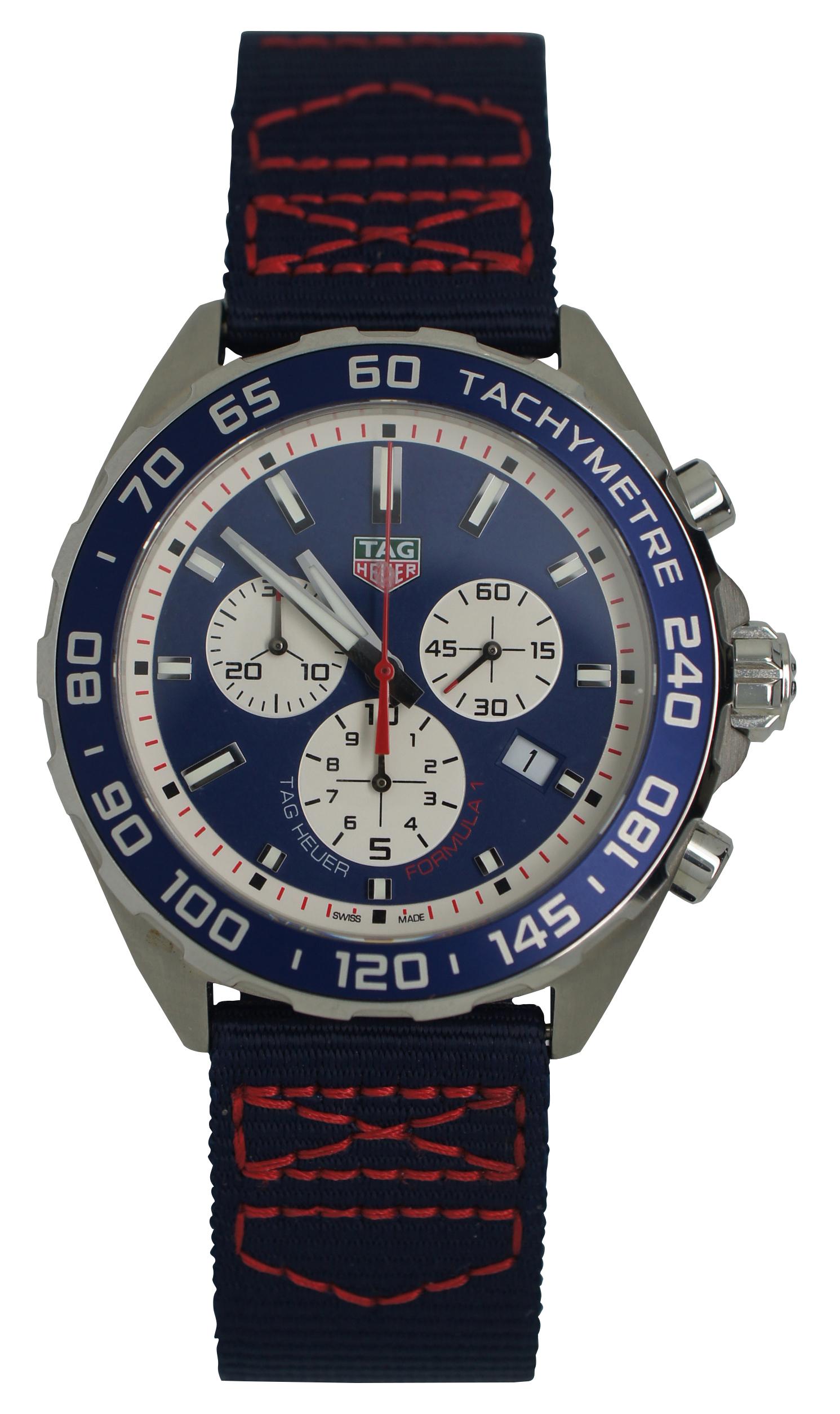 TAG Heuer CAZ1018/WBC1283 Red Bull Racing Formula One Team special edition wrist watch with nylon band.

Adjustable band – 6.5” to 8.75” x 0.875” / Face - 1.75” x 1.875” (Length x Width).