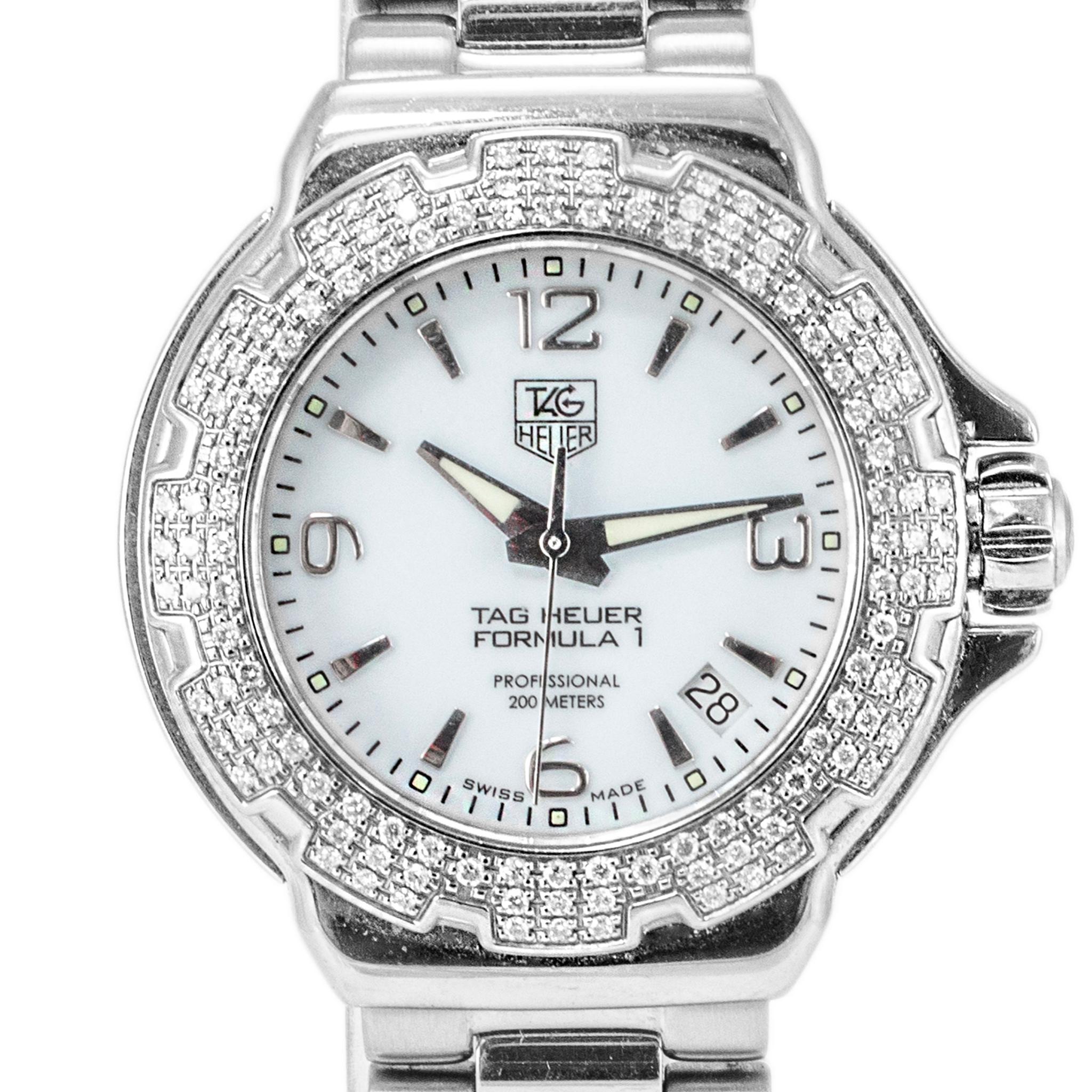 Brand: Tag Heuer

Gender: Ladies

Metal Type: Stainless Steel

Diameter: 37.00 mm

Weight: 102.82 grams

One ladies stainless steel diamond TAG HEUER Swiss-made watch with original box and papers. The metal was tested and determined to be stainless