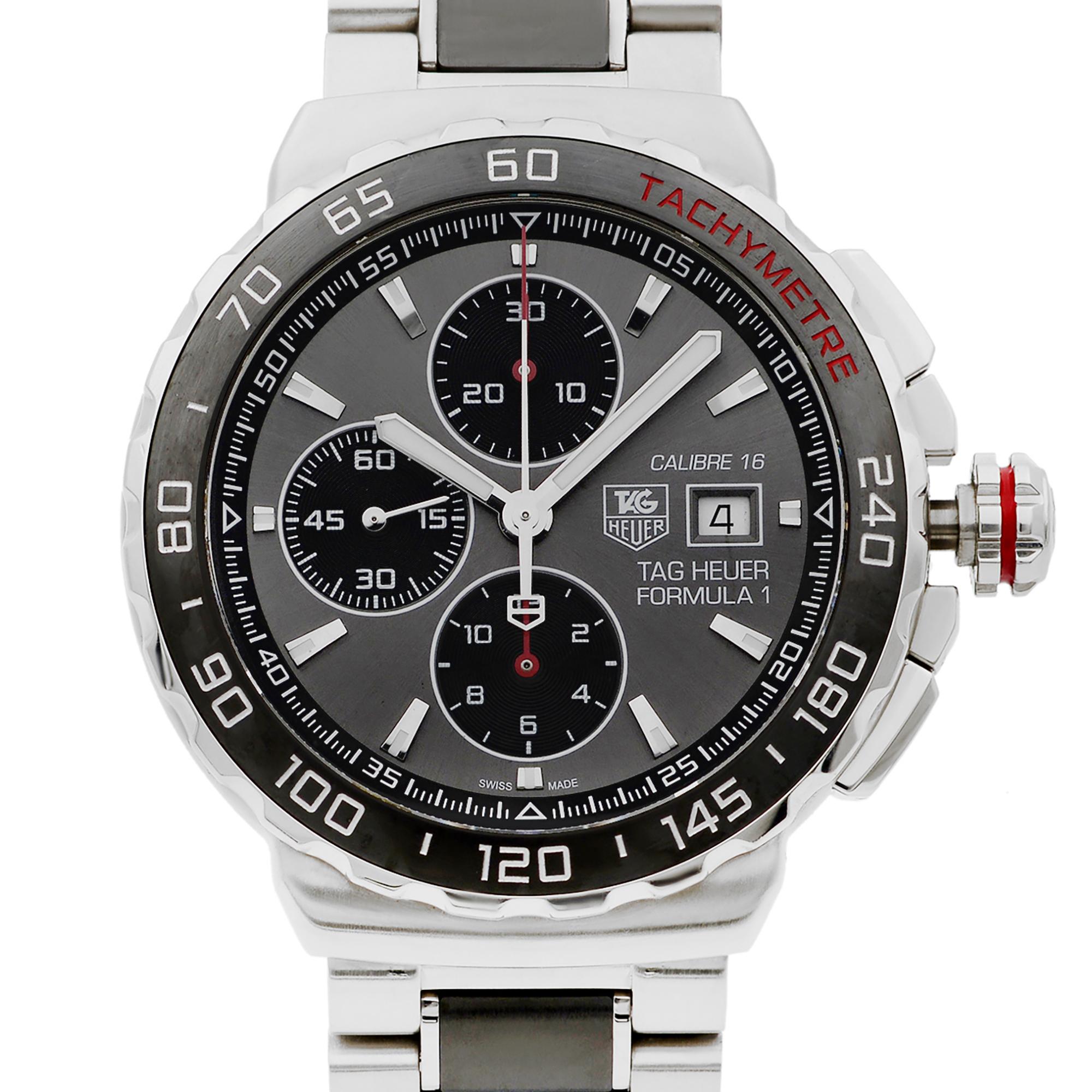 Pre-owned Mint Condition TAG Heuer Formula 1 Men's Watch CAU2011.BA0873.This beautiful timepiece that is powered by mechanical (automatic) movement which is cased in a stainless steel case. It has a round shape face, chronograph, date indicator,