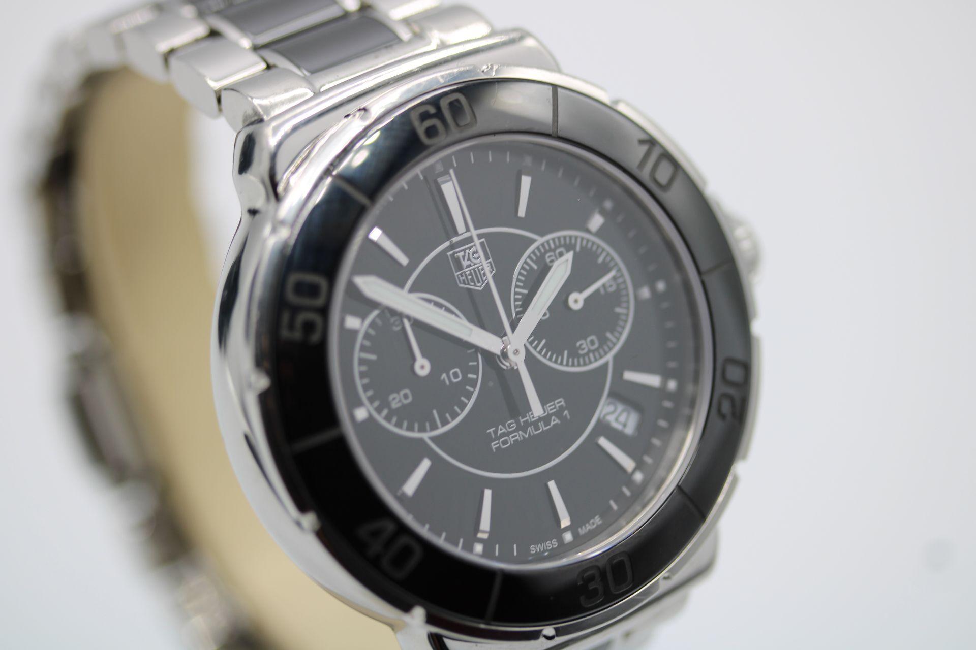 Presented in excellent working order and condition accompanied by its inner and outer boxes, wallet, two manuals, a service card and warranty card dated 11/11/11 in addition to our 12 month warranty.

The Tag Heuer Formula 1, model CAH1210, features