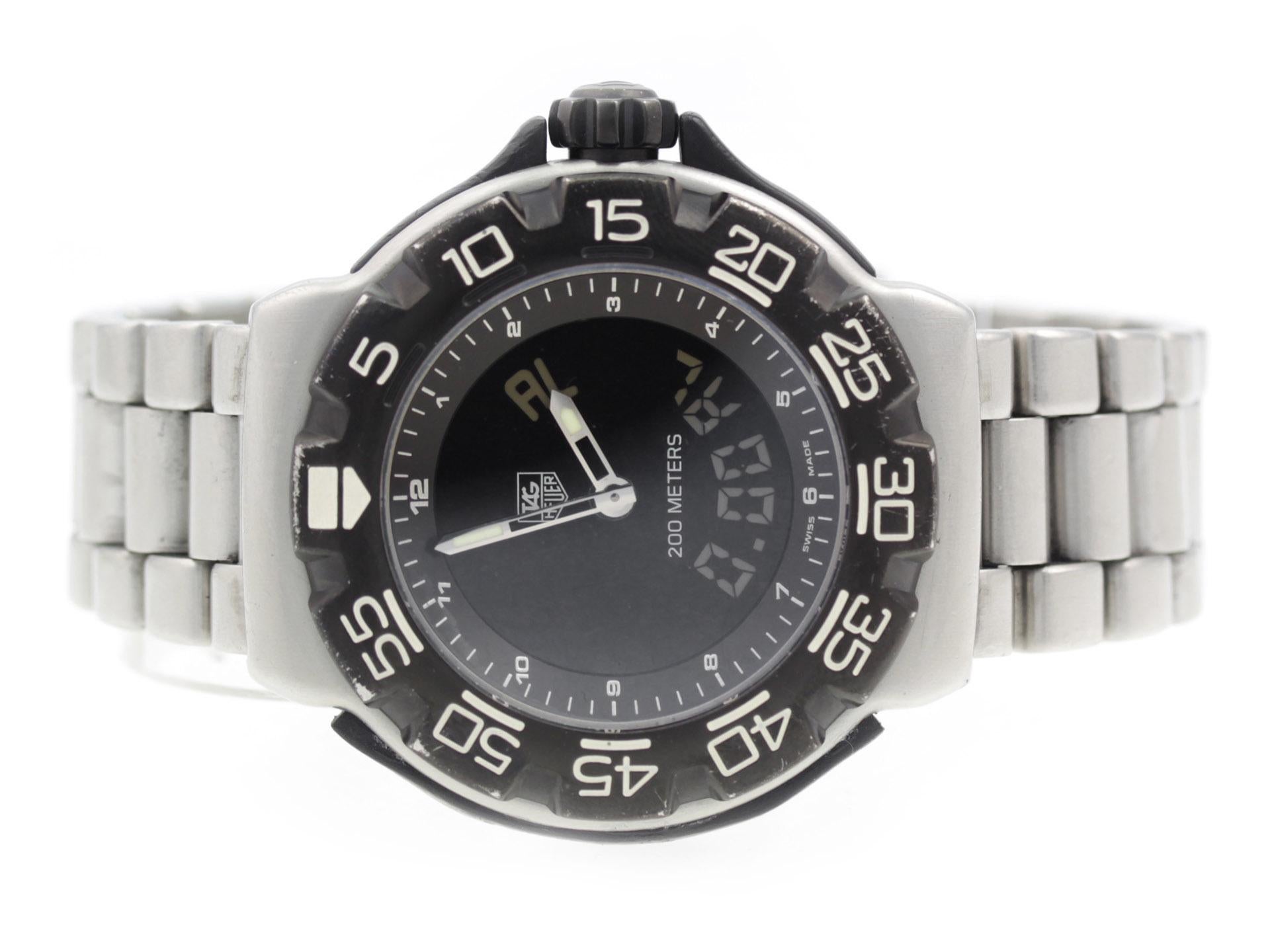 Tag Heuer F1 Chronotimer CAC111D.BA0850 watch, water resistant to 200m, with date, chronograph, and bracelet.

Watch	
Brand:	TAG Heuer
Series:	F1 Chronotimer
Model #:	CAC111D.BA0850
Gender:	Men’s
Condition:	Fair Condition Pre-owned Watch, Scratches