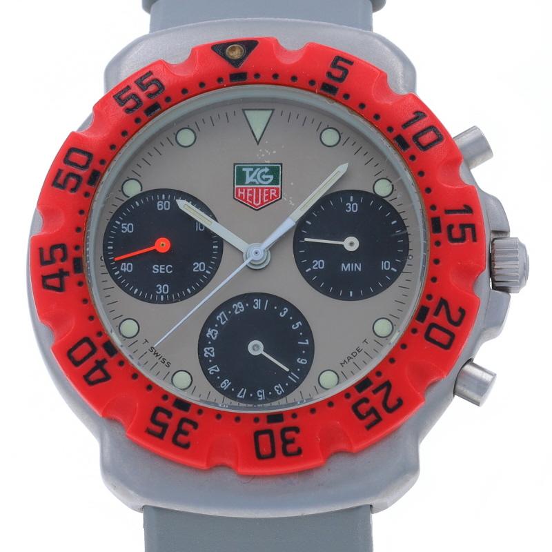 Brand: Tag Heuer
Model: Formula 1
Model Number: 472.513
Movement: Quartz
Number of Jewels: 7
Movement Maker: Swiss
Dial Color: Tan

Metal Content: Stainless Steel

Material Information
Rubber Band
Color: Grey

Fastening Type: Buckle Clasp
Features:
