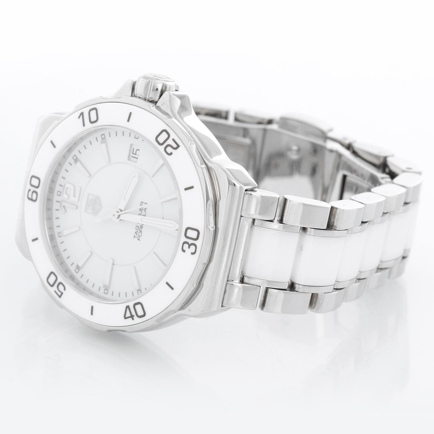 Tag Heuer Formula 1 White Ceramic Ladies Quartz Watch - Quartz. Stainless steel case with white ceramic bezel (34mm diameter). White with stick hour markers . Stainless steel and white ceramic bracelet; will fit a 6 inch wrist . Pre-owned with