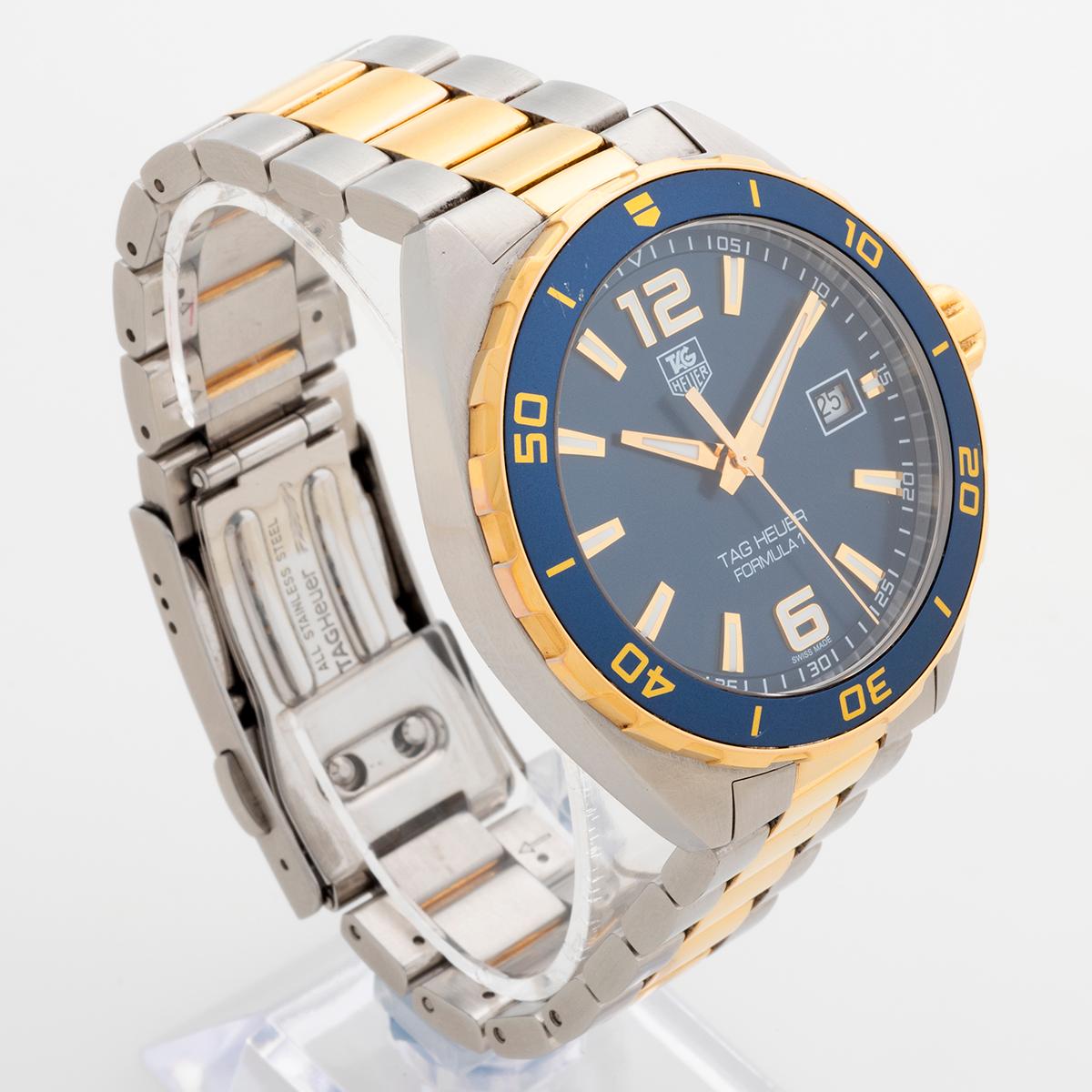 Our attractive and rare Tag Heuer Formula 1 with quartz movement, reference WAZ1120, features a 41mm stainless steel and gold plated case with blue dial and bezel and stainless steel and gold plated bracelet. Presented in excellent condition, with