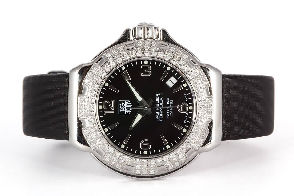 We are pleased to offer this Ladies Tag Heuer Ladies Formula 1 Diamond Bezel Quartz Watch WAC1214. It features a black dial, stainless steel 120 diamond bezel and swiss quartz movement set in a 37mm stainless steel case. It has a black nylon strap