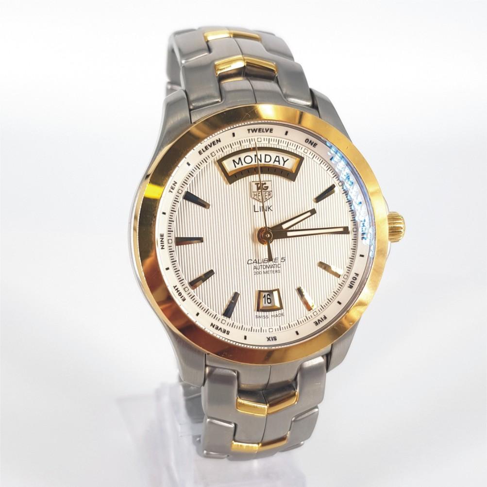 Tag Heuer Link Calibre 5 – Automatic in Excellent condition. 
Serial Number: RWE8020 
Model Number: WJF2050
Year: 2013 - 2018
Stainless Steel & Yellow Gold Case measuring 41mm with a Silver Dial with Gold Hands & Stainless Steel and Yellow Gold