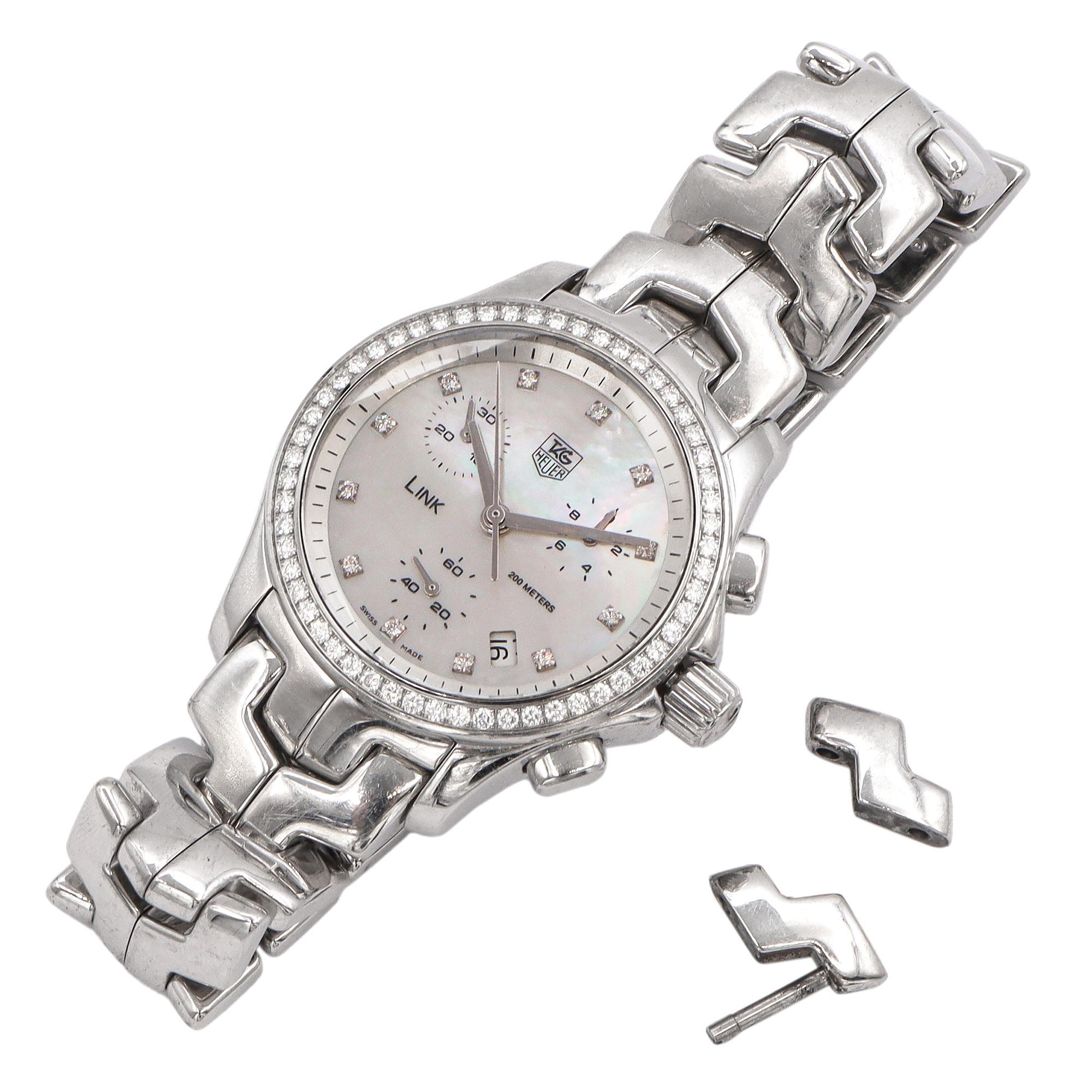 This is a TAG Heuer Link chronograph wristwatch, an elegant blend of sporty functionality and refined luxury. Crafted from polished stainless steel, the watch features TAG Heuer’s signature S-shaped link bracelet, known for its comfort and