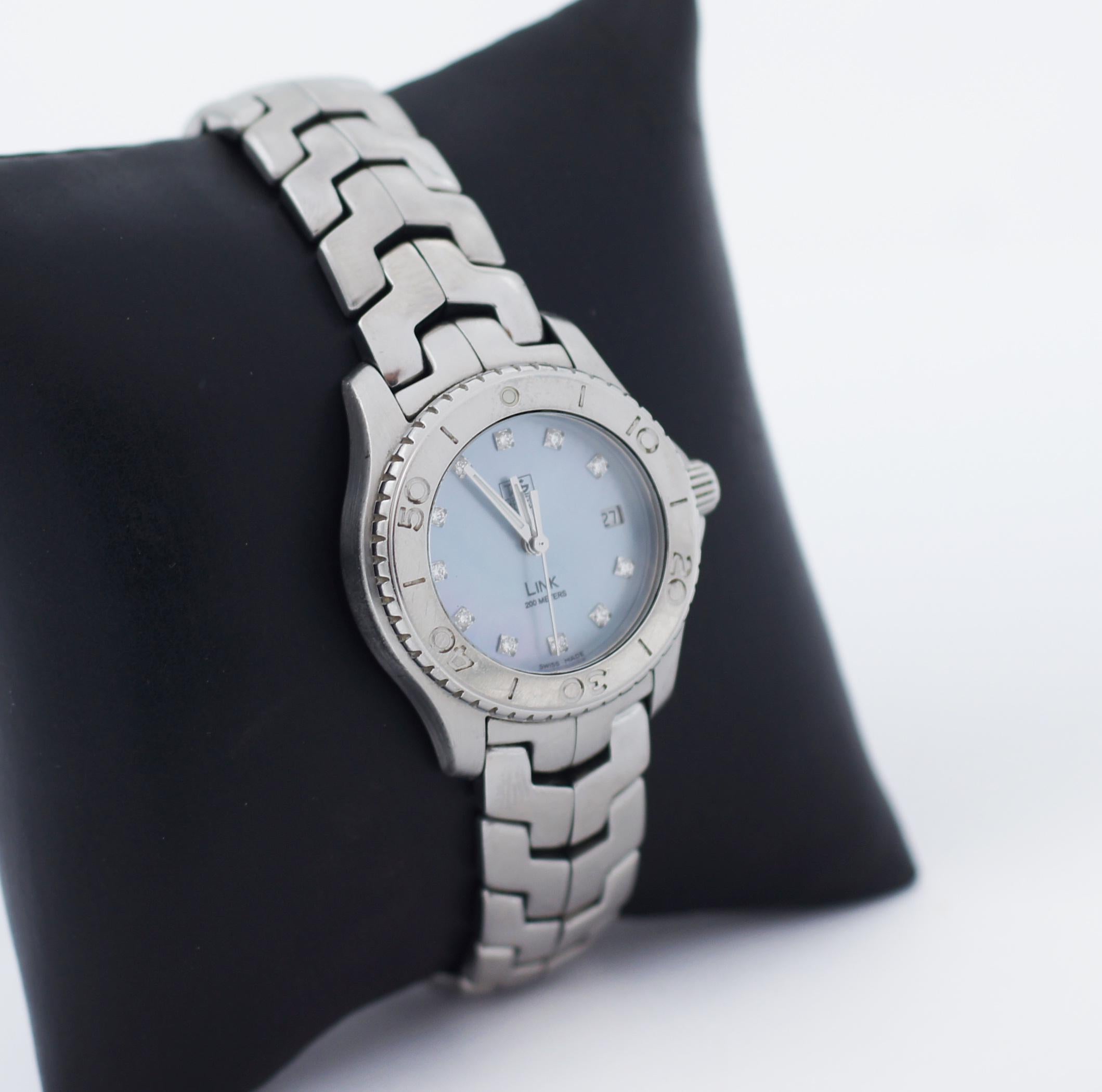 TAG HEUER
LINK
WJ1317-0
Swiss Made
Polished with Brushed Stainless Steel Case & Bracelet
Mother of Pearl Blue Dial Set with Diamonds
Diamond Hour Markers
11 Full Cut Diamonds Set on Dial (Approx. 0.081 ct)
Polished Stainless Steel Bezel with