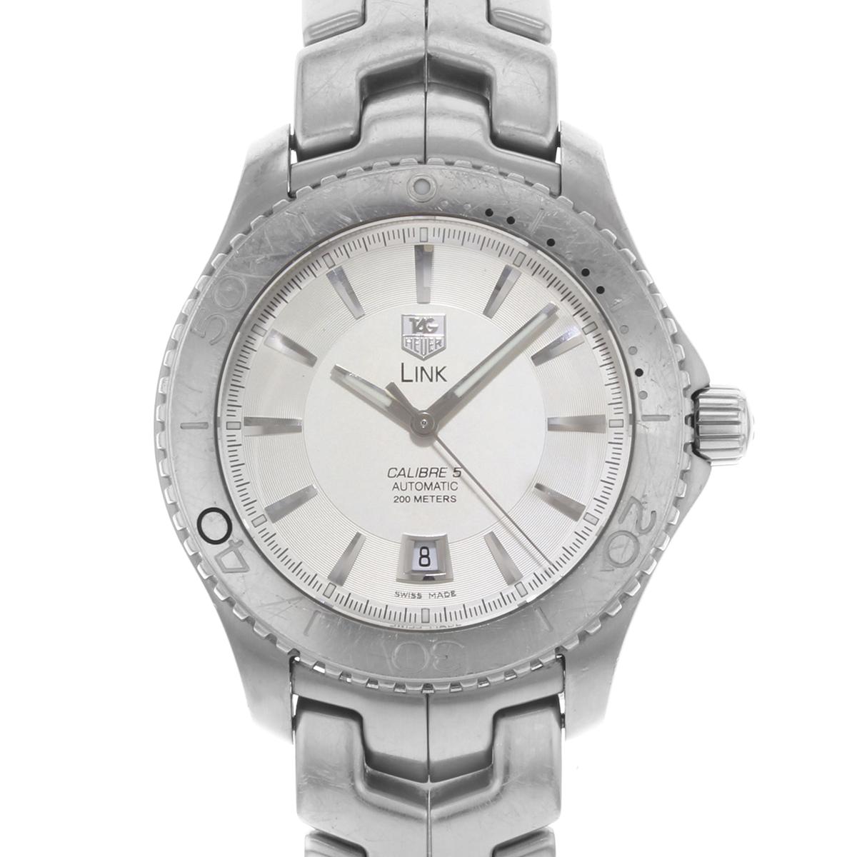 This pre-owned TAG Heuer Link WJ201B.BA0591 is a beautiful men's timepiece that is powered by an automatic movement which is cased in a stainless steel case. It has a round shape face, date dial and has hand sticks style markers. It is completed