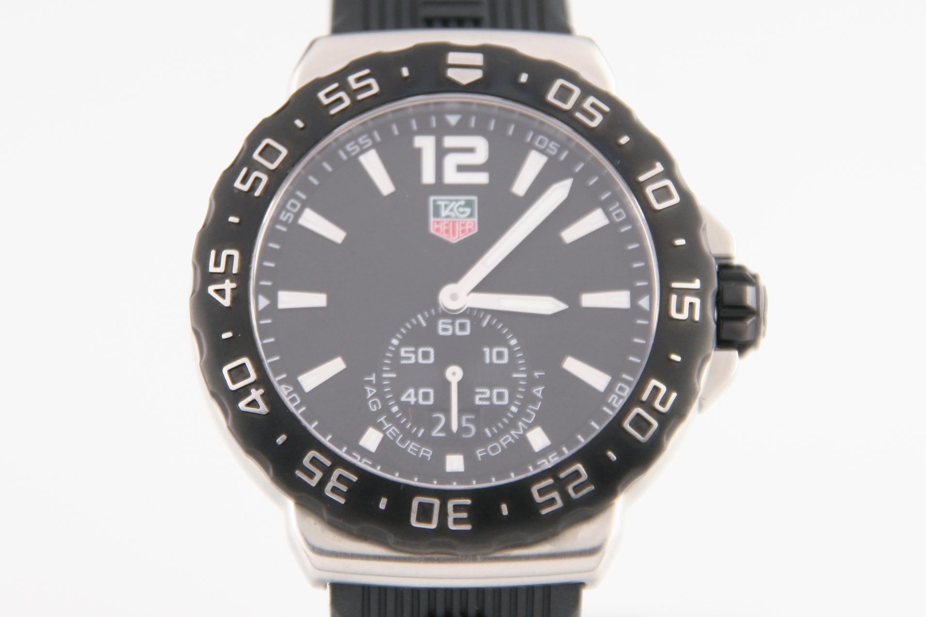 Tag Heuer Men's Formula Quartz Watch w/ Rubber Tag Heuer Band WAU-1110
Model: Formula
Model #WAU-1110
Serial #RPN0940
Brushed Stainless Steel Case w/ Black-Coated Steel Bezel
41 mm in Diameter (45 mm w/ Crown)
Lug-to-Lug Distance = 43 mm
Thickness =