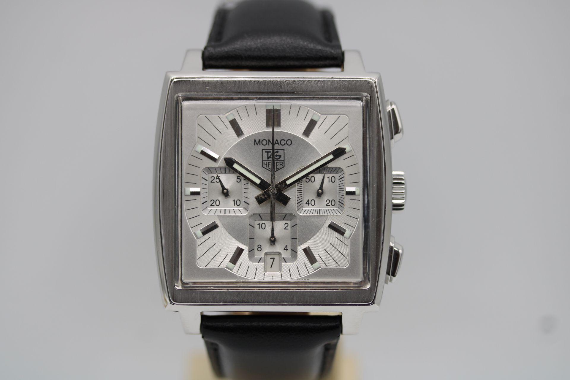 This Tag Heuer Monaco CW2112 is presented in excellent working order and also as a complete set with inner and outer boxes, two manuals and warranty card dated November 2002 in addition to our 12-month warranty.

This Tag Heuer Monaco, model CW2112,
