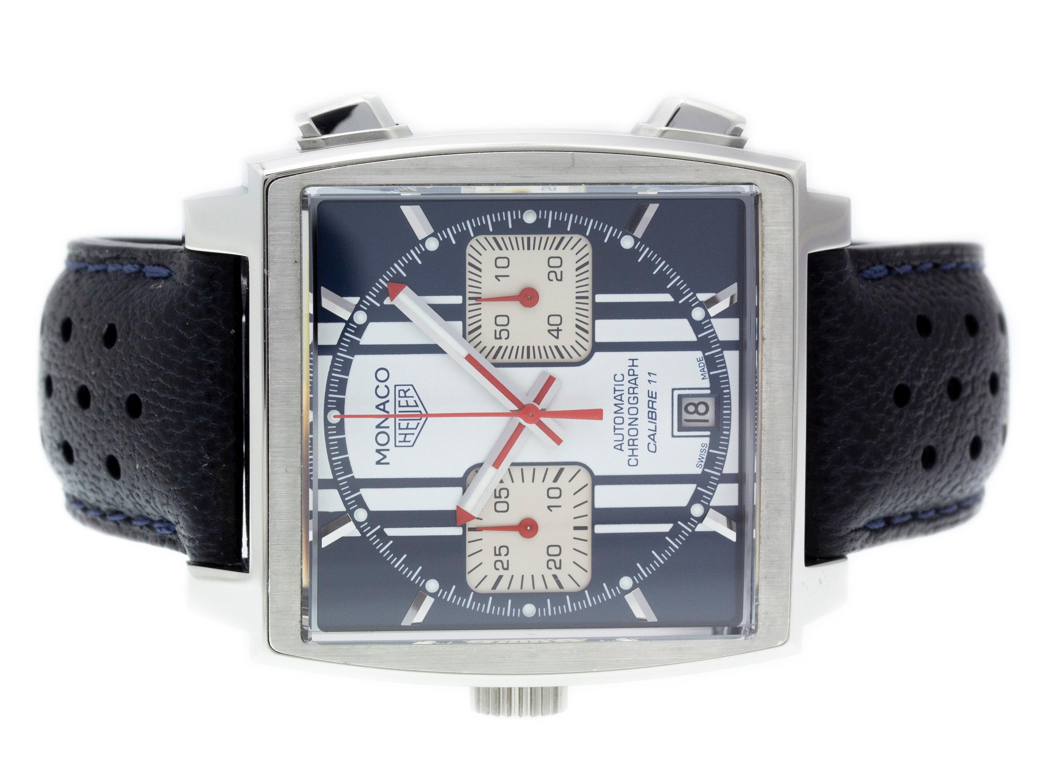 Stainless steel Tag Heuer Monaco automatic watch with a 39mm case, blue & white dial, and blue leather strap with folding clasp. Features include hours, minutes, seconds, date, and chronograph. Comes with a Tag Box and 2 Year Store
