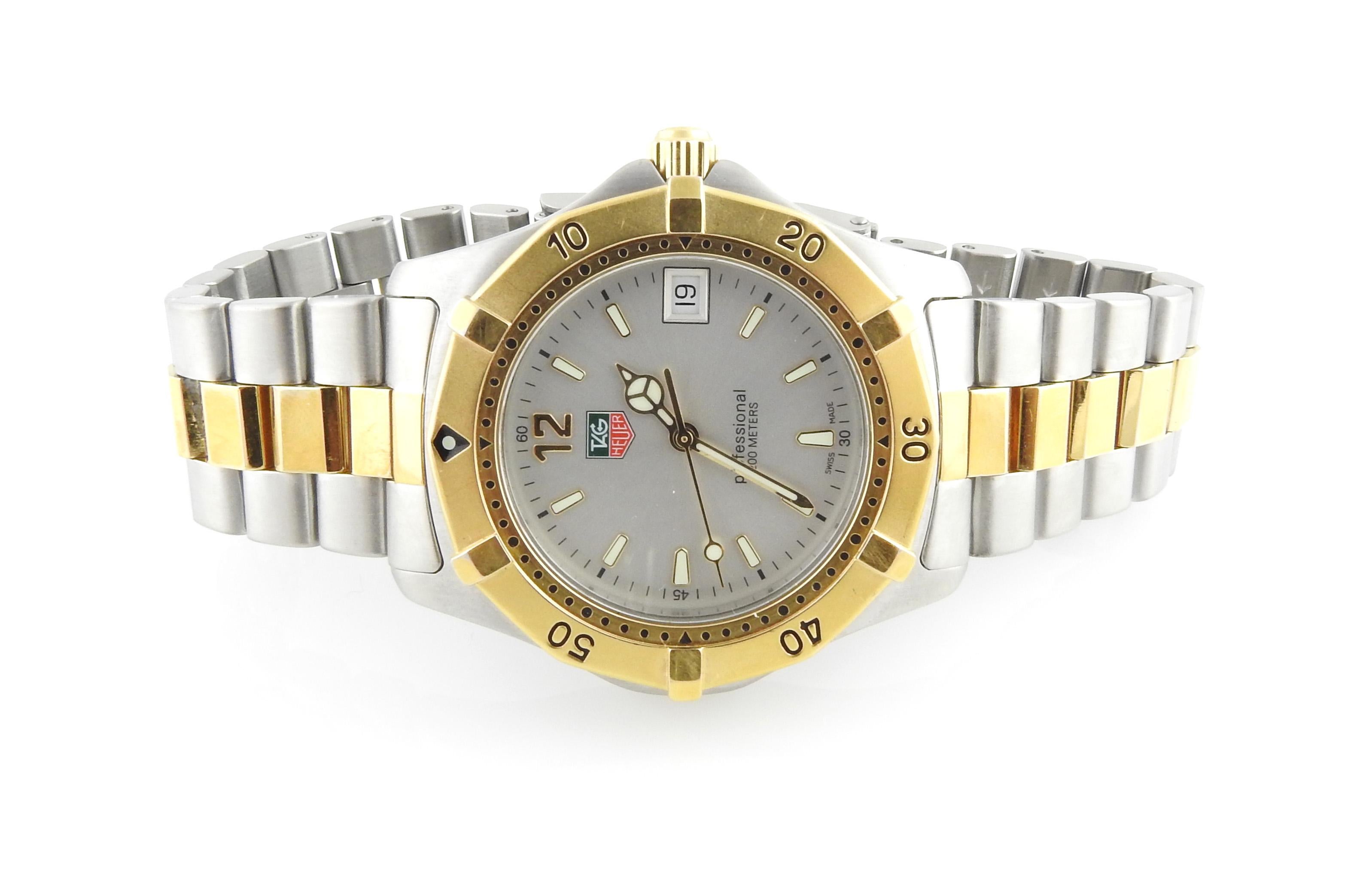 TAG Heuer Professional Men's Watch

Model: WK1120-0
Serial: QP3075

TAG Heuer men's two tone watch - stainless steel and gold

Quartz movement

36mm case size

Silver dial

Gold Bezel, steel case

Gold and steel band - Fits up to 7.5