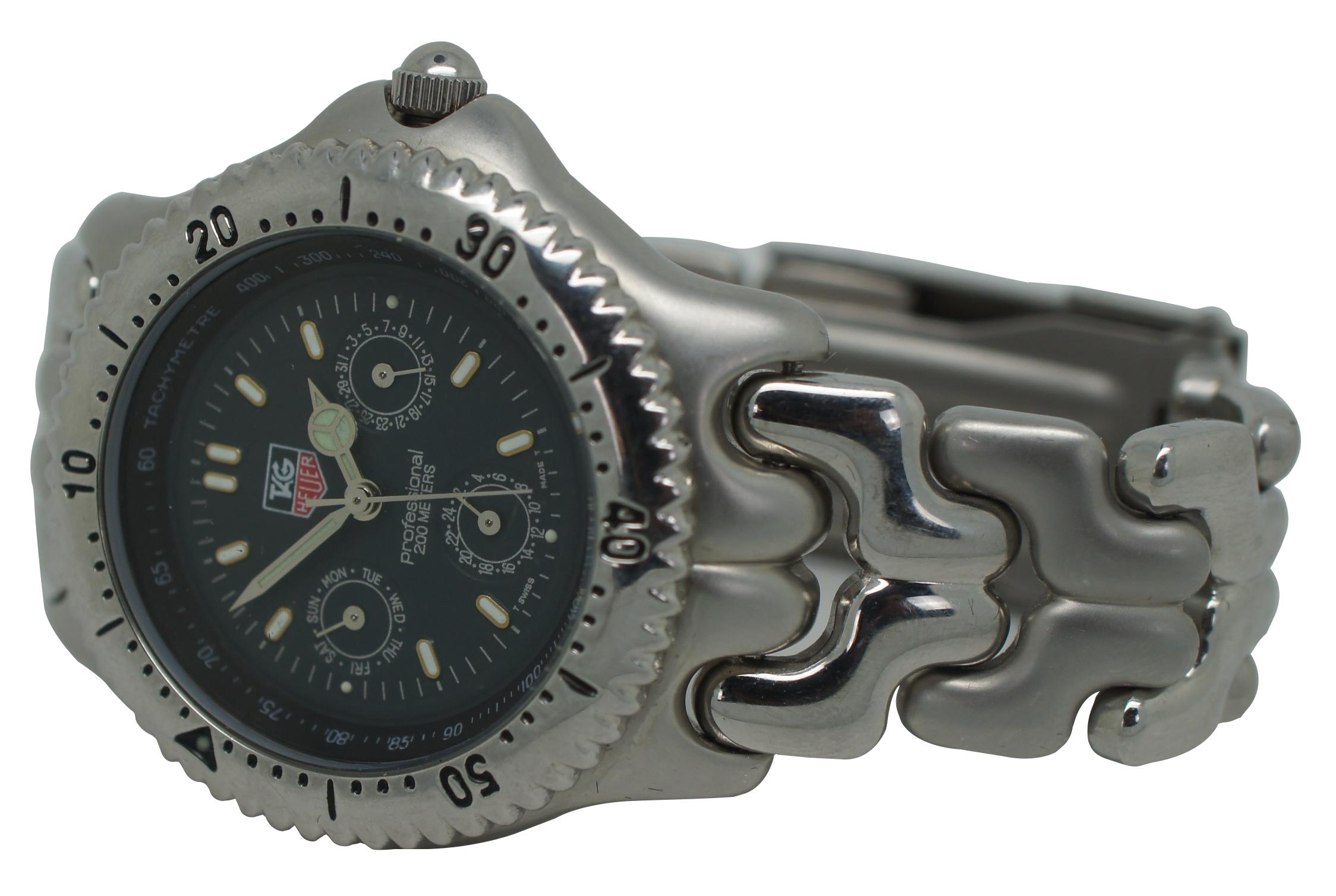 Tag Heuer chronograph wristwatch with tachymetre, stainless steel case and band, water resistant to 200 meters.

Measures: Band - 8” x 0.75” / Face – 1” (Length x Width).