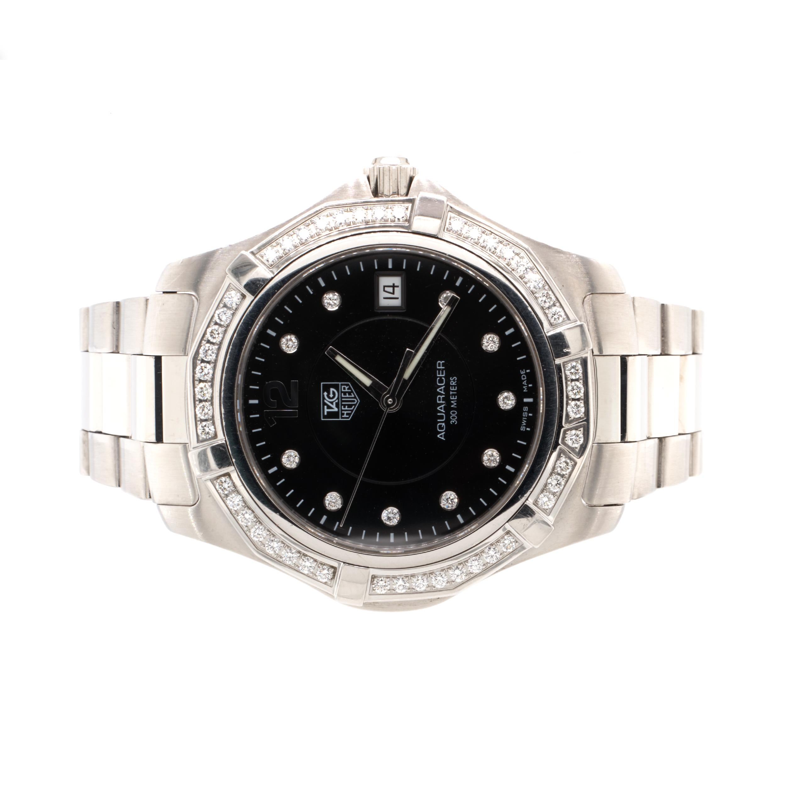 Movement: quartz
Function: hours, minuets, seconds, date
Case: 39mm stainless steel round case, diamond bezel,  pull push crown, sapphire crystal
Dial: black dial, diamond hour markers, steel hands, date at 3 o’clock
Band: Tag Heuer stainless steel