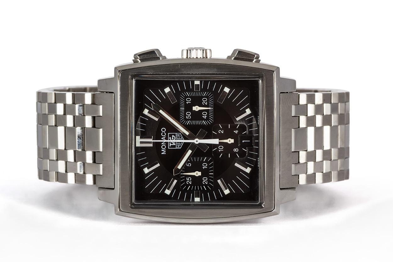We are pleased to offer this Tag Heuer Stainless Steel Monaco Chronograph Mens Watch CW2111. This watch features a 38mm stainless steel case, automatic chronograph movement, black dial and stainless steel bracelet. It will fit up to an 7.75