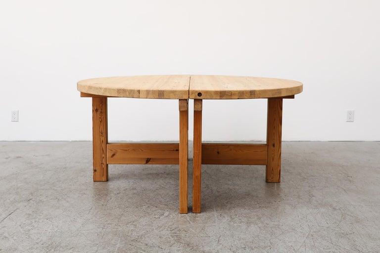Unique, heavy round pine dining table designed by Tage Poulsen for GM Möbler. The extension leaf is its own separate table and can be used as a stand alone console table while not used as an extension for the round table. Extends to 83.25