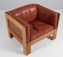 Tage Poulsen lounge chair, in Oak and Patinated Leather, Denmark, 1970s