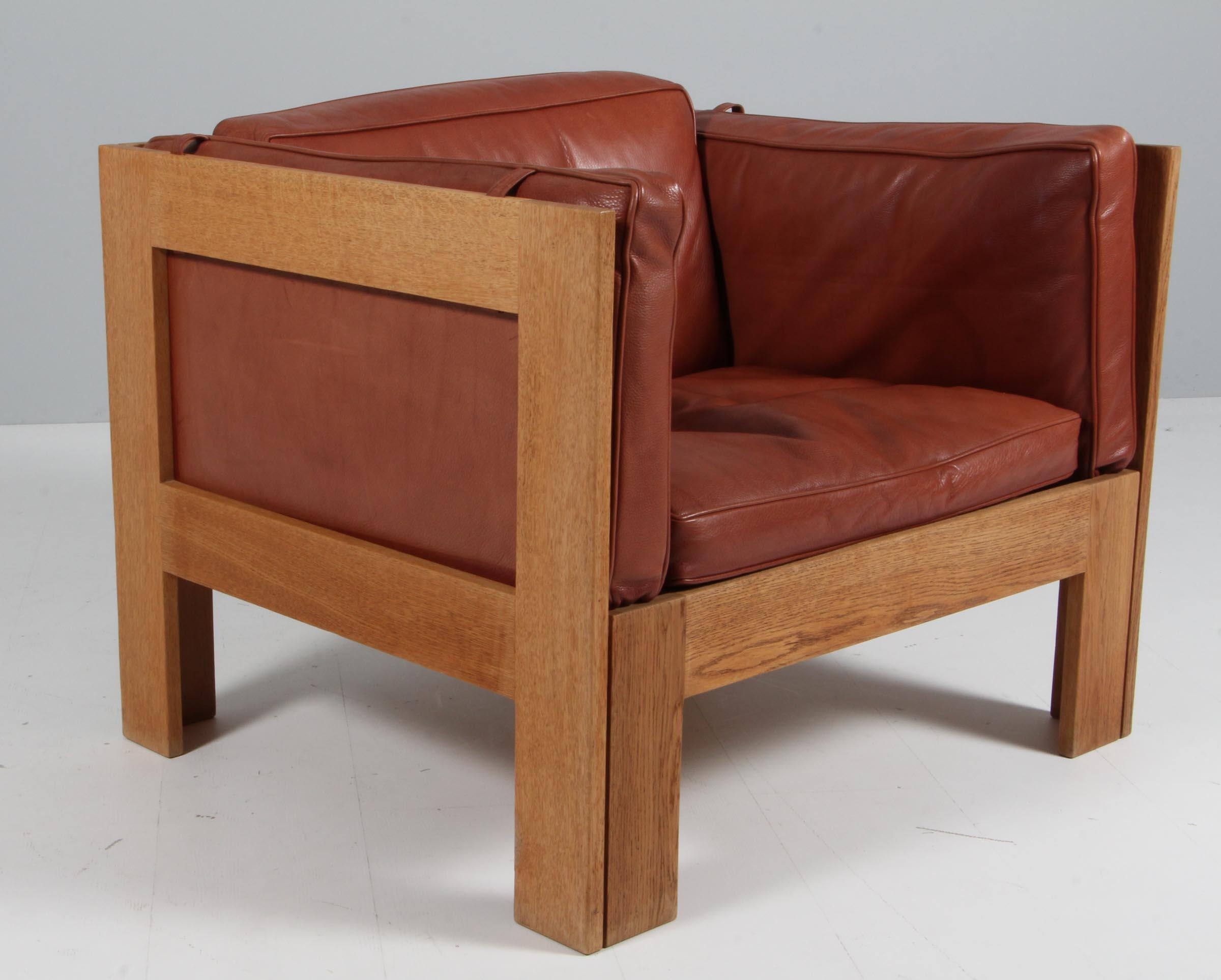 Scandinavian Modern Tage Poulsen lounge chair, in Oak and Patinated Leather, Denmark, 1970s