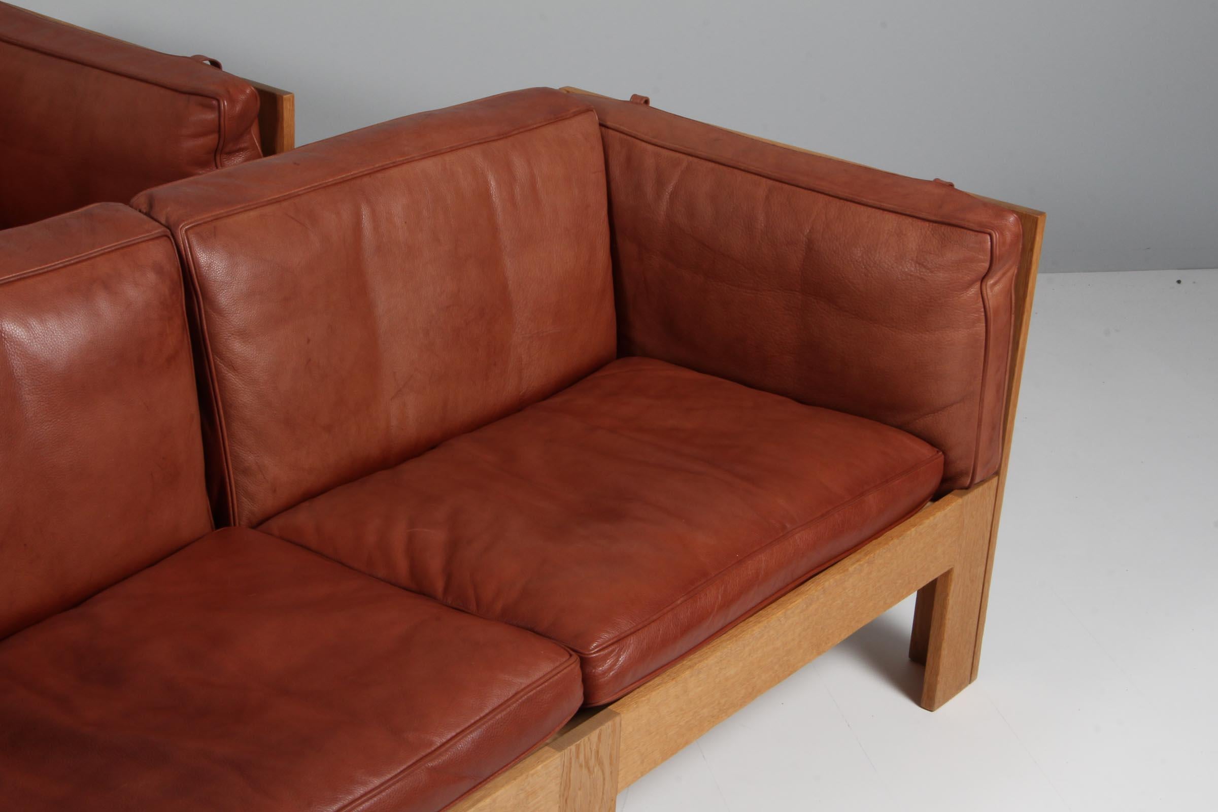 Scandinavian Modern Tage Poulsen lounge chair, in Oak and Patinated Leather, Denmark, 1970s