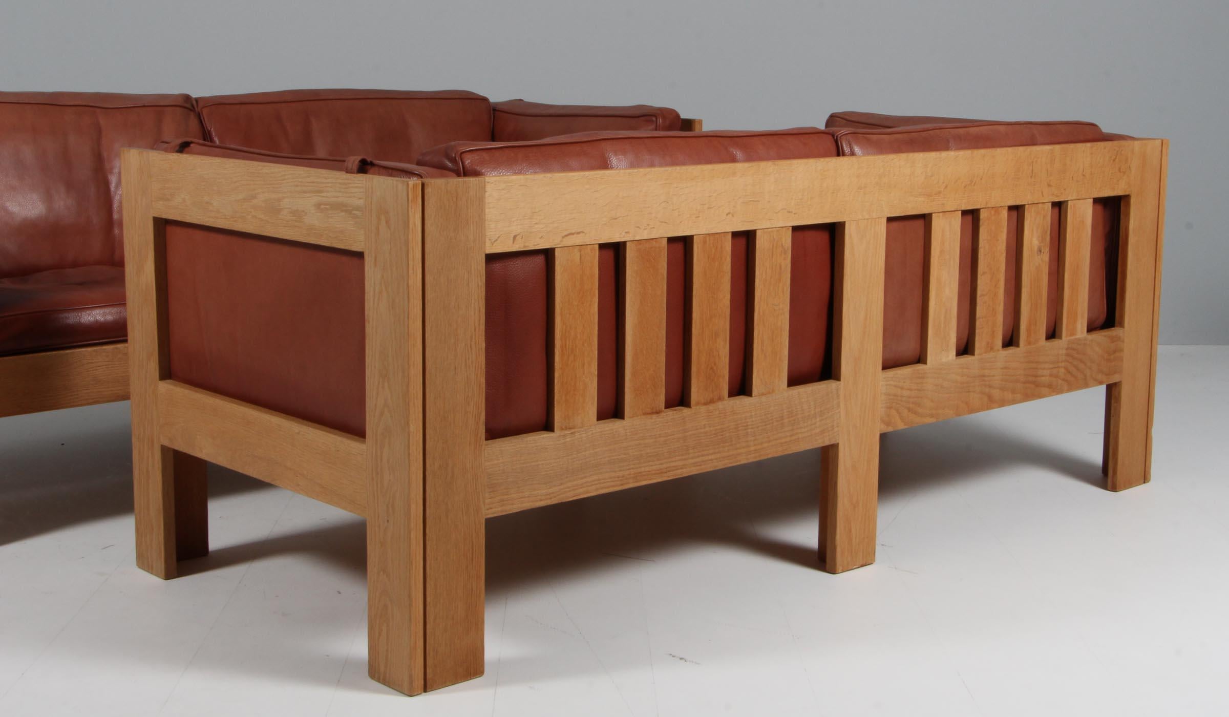 Late 20th Century Tage Poulsen lounge chair, in Oak and Patinated Leather, Denmark, 1970s