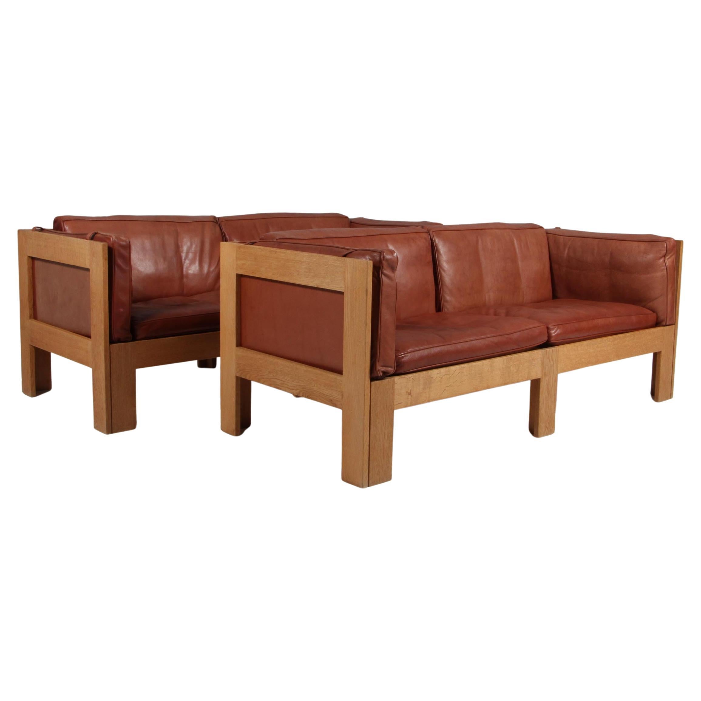 Tage Poulsen lounge chair, in Oak and Patinated Leather, Denmark, 1970s