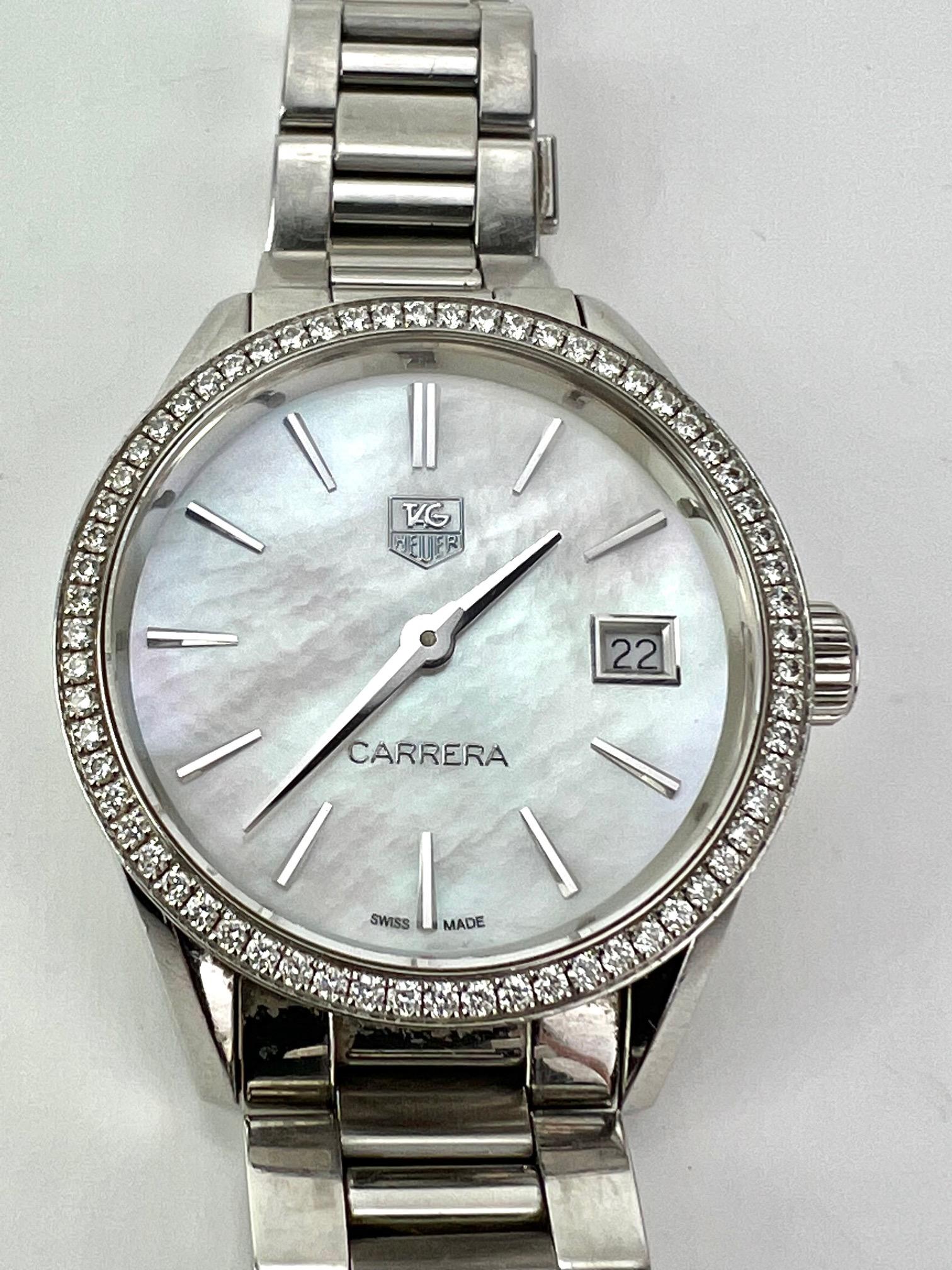 Preowned 100% Authentic
TAGHEUER Carrera Mother of pearl Diamond Bezel Date Watch
RATING: B-...Good, shows minor signs of use, 
has some scratches 
MODEL: WAR1315
ID NUMBER: WWA1900
GENDER: ladies
MATERIAL: stainless steel, mother-of-pearl
and