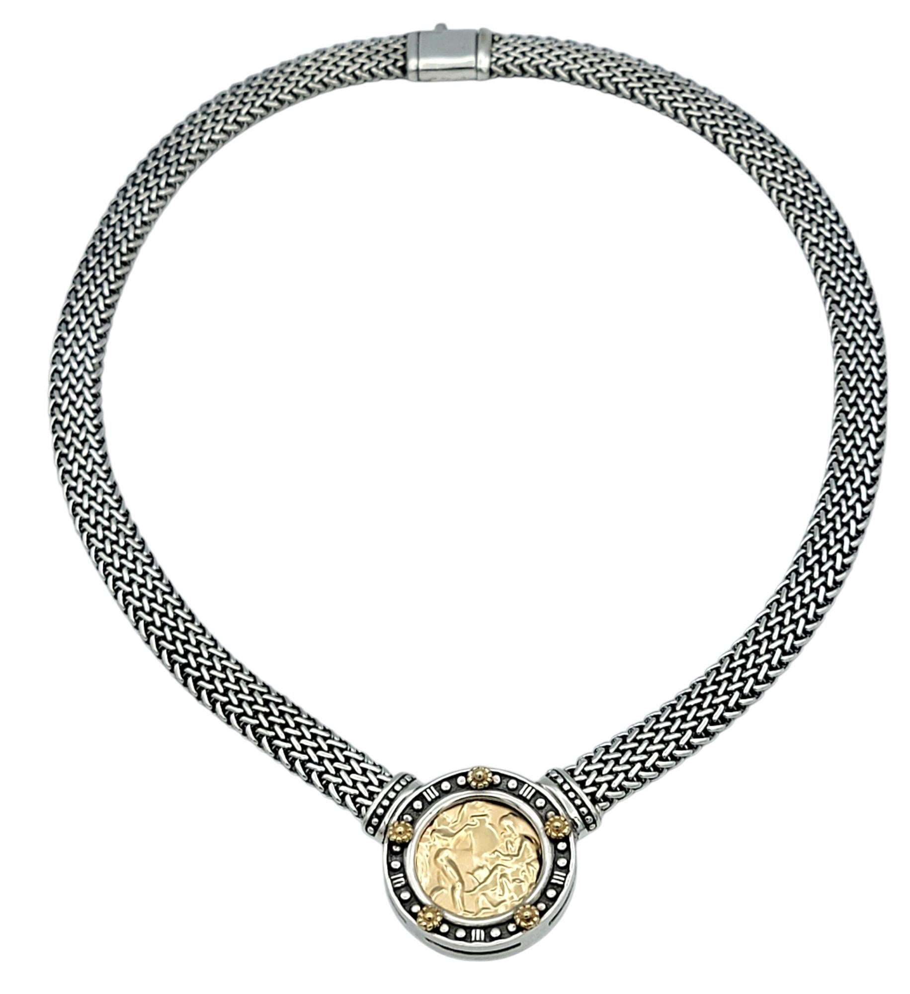 Elevate your style with this striking mixed-metal Tagliamonte necklace that exudes elegance and sophistication. The bold centerpiece features a stunning 14 karat yellow gold medallion intricately detailed with a classical motif, radiating timeless