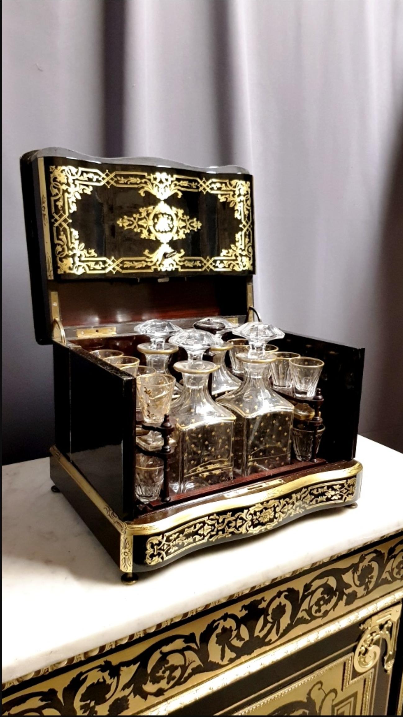 Rare and historical Napoleon III Liquor Cellar cabinet in Boulle style marquetry Signed by Tahan the best and famous the official liquor cabinet maker to the Emperor Napoleon 3. 
In brass marquetry with scroll patterns, tracery and foliage. Large