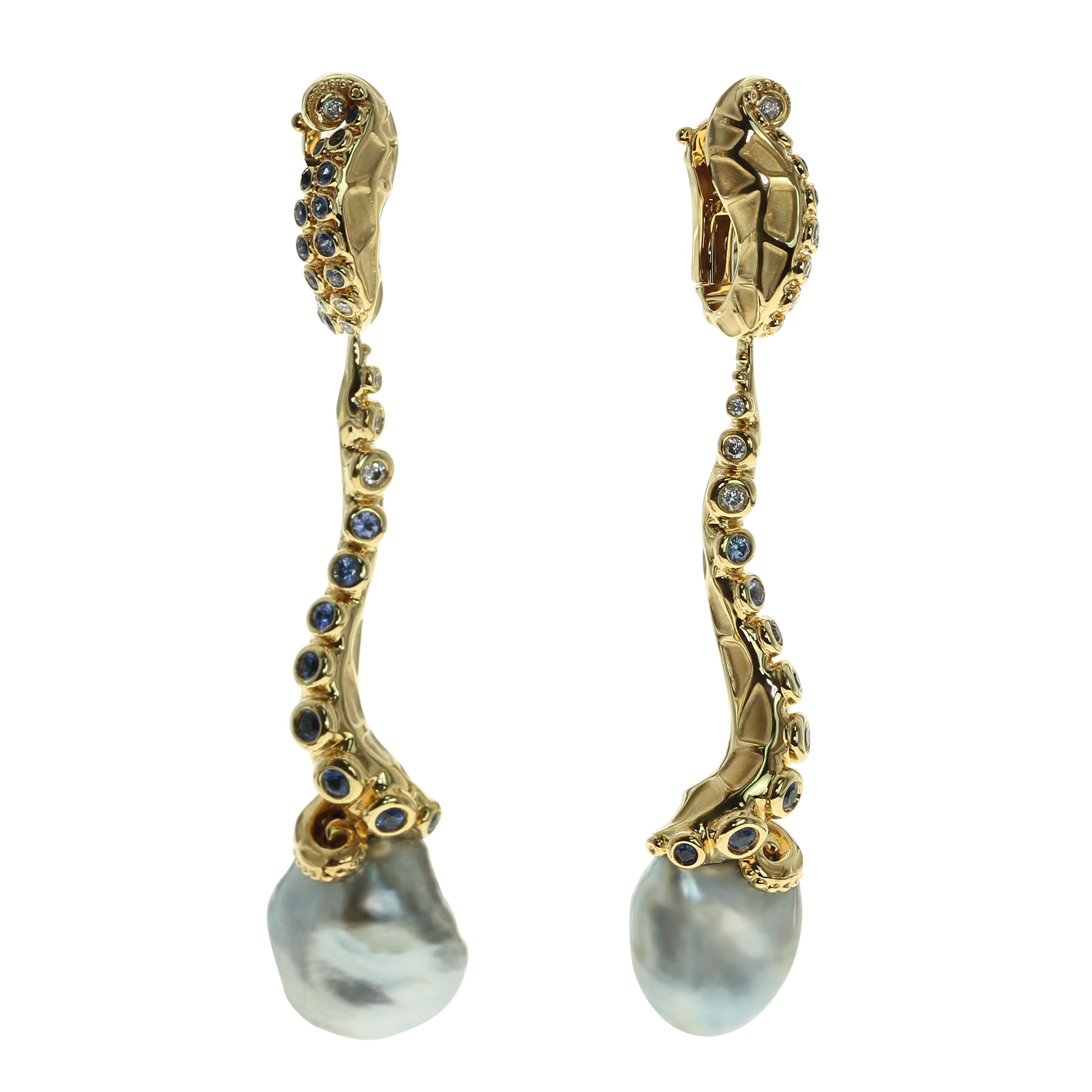 Tahiti Keshi Pearl 21,57 Carat 18 Karat Yellow Gold Octopus Earrings
Earrings are made in the shape of an octopus tentacle in Yellow glossy and matte 18 Karat Gold. At the base of their suckers you can see setted Blue Sapphires and Diamonds. At the
