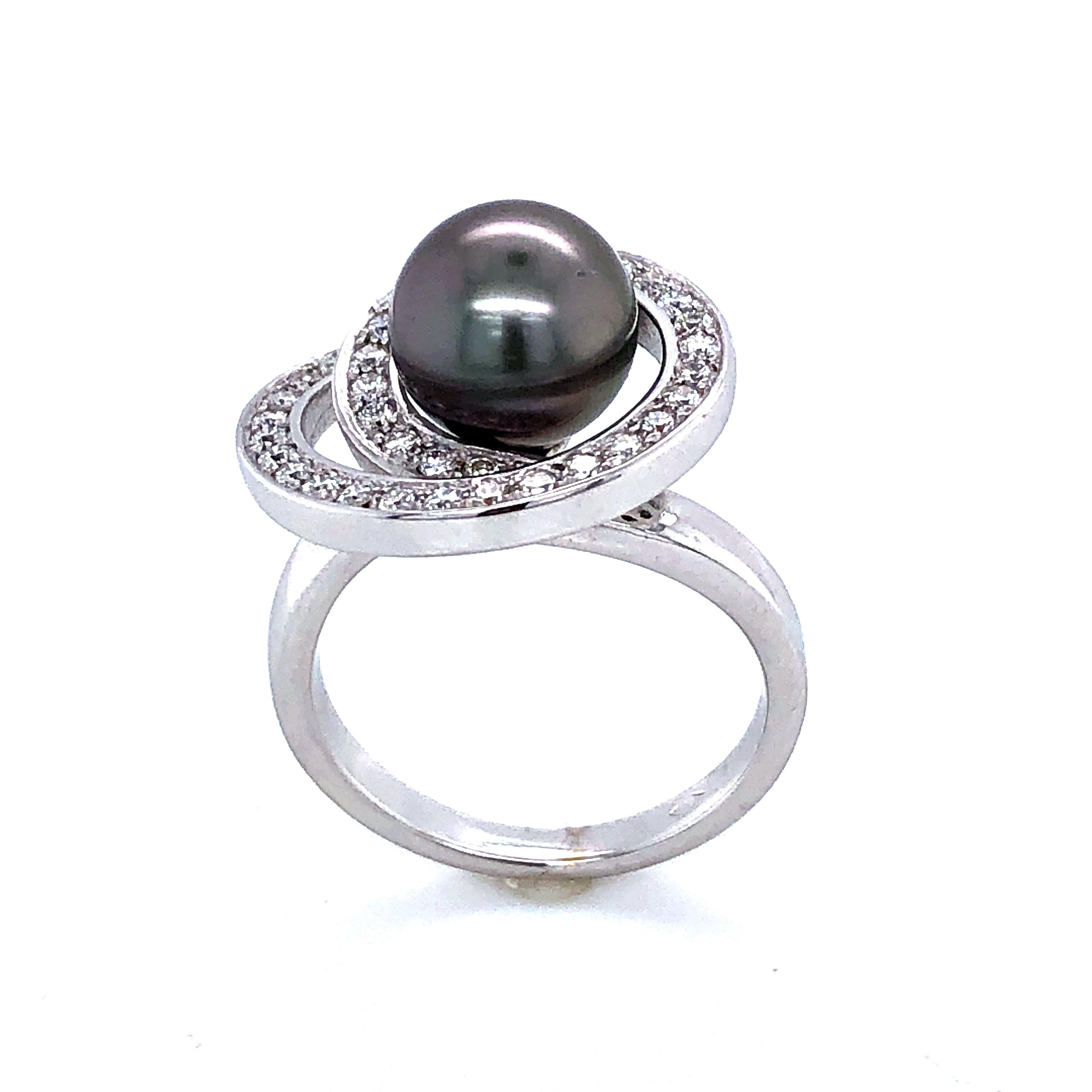 Tahiti pearl and diamonds on White Gold Ring 18 k
Diamonds Snail With Tahiti Pearl on Central Ring 
Diamonds : 0.47 ct 
Size of Tahiti pearl : 9/9.5 m
Weight Of Gold : 7.91
French Size :52.5
US Sise :6.5
British Size : M.5