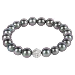 Tahiti pearl bracelet with an 18k WG and 0, 65ct diamond pavé sphere