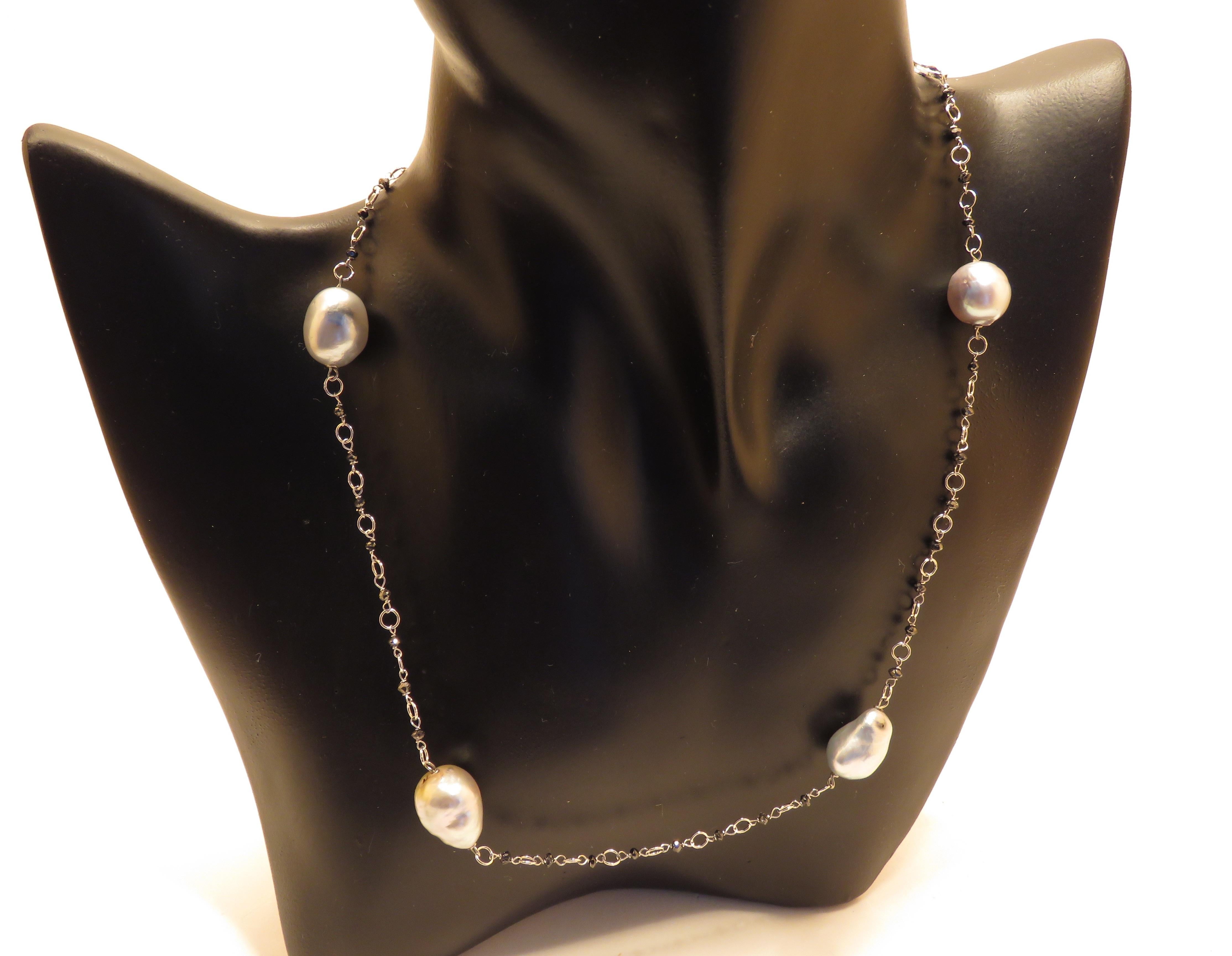 Unbelievable 5 natural Tahiti pearls (12 x 10 millimeters / 0.47 x 0.39 inches) and black diamonds necklace in 18k white gold. 
Total length is 430 millimeters / 16.92  inches.
Handcrafted in Italy by Botta Gioielli.
This item is stamped with the
