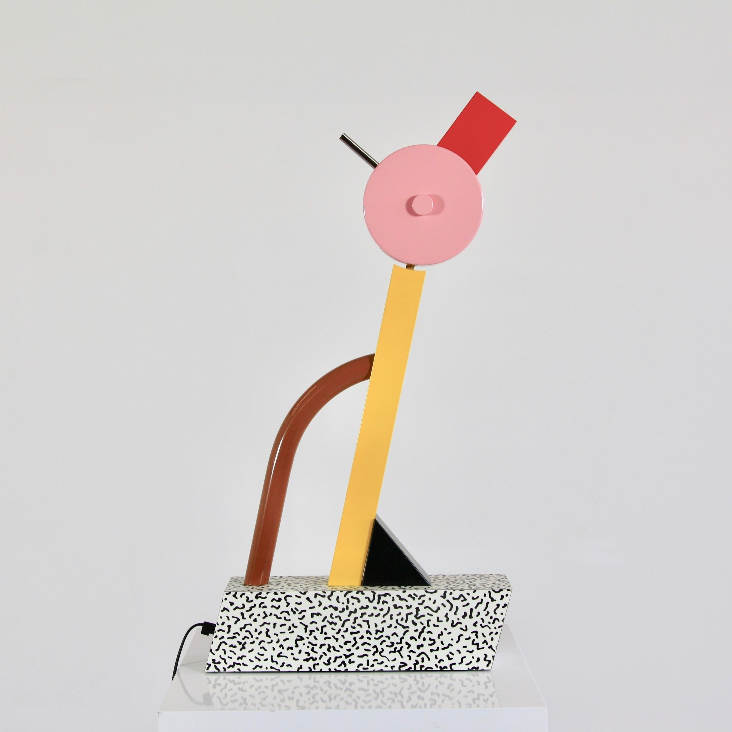 Tahiti table lamp, designed by Ettore Sottsass. Italy, 1981.

Metal construction, wooden base with laminate and head with halogen lamp, 'The Duck'. With original metal label.

Reference: Fiell. 1000 Lights. 1960 to the present. P. 316,