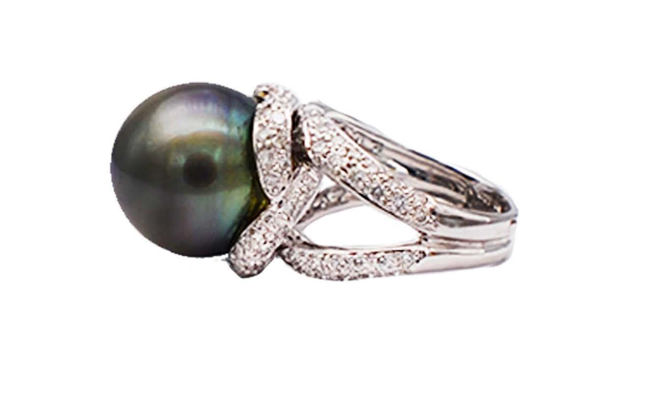 JYE Award, Tahitian 14.5 mm Quality, 18Kt White Diamond Ring.
JYE Award Winners designer Hallmarked quality ring. Stunning Tahitian Grey Pearl 14.50 mm. 
Consistent color hue, brilliant luster.
 Diamonds are set on an 18 kt. Split shank with wrapped