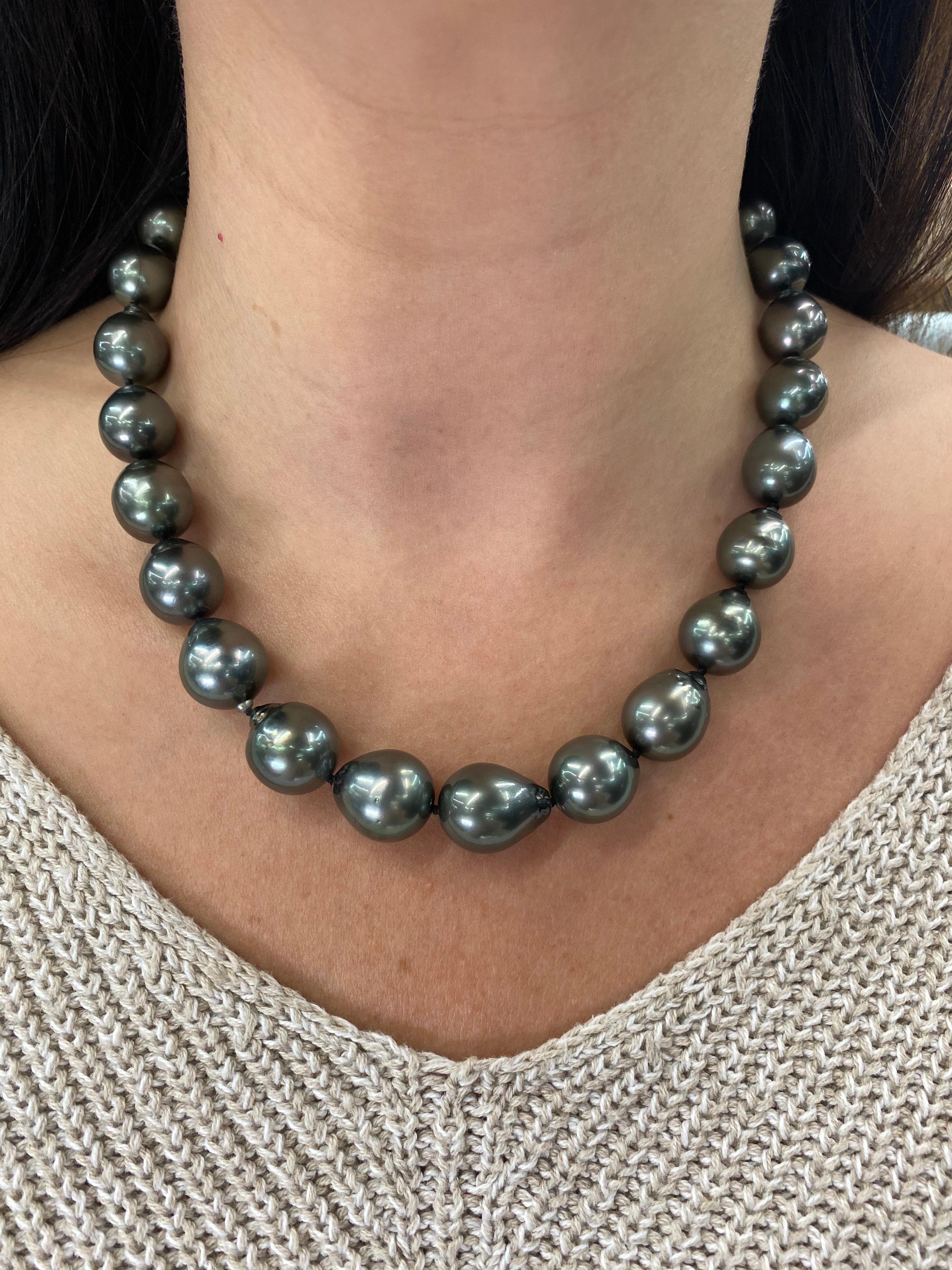 Perfectly matched pearl strand necklace featuring 27 Tahitian baroque pearls measuring 12-14.9 mm with a high polish ball clasp in 14K White Gold. 

Pearl quality: AAA
Pearl Luster: AAA Excellent
Nacre : Very Thick

Strand can be made to order,
