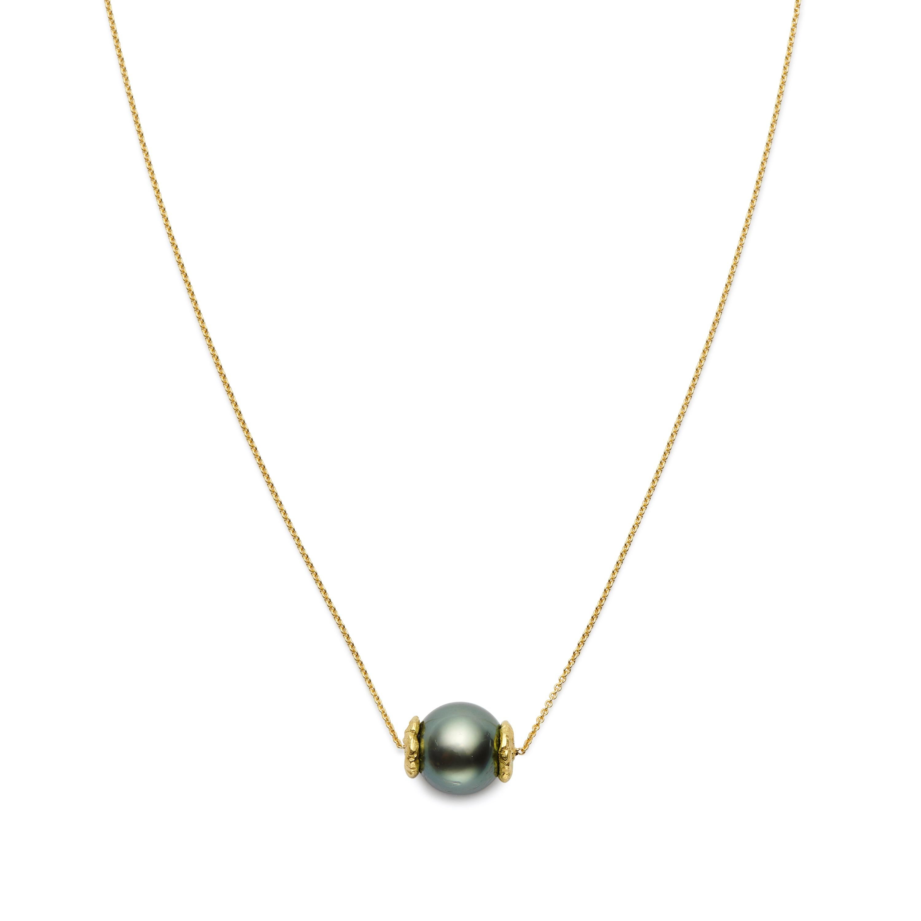Simple elegance. A classic, 12.5mm Tahitian Black Pearl is cradled by Susan Lister Locke’s signature “Seaquins” and displayed on a 16-inch 18 Karat Gold chain. 

***Custom Order Only: Please allow 3-4 weeks for delivery.***
