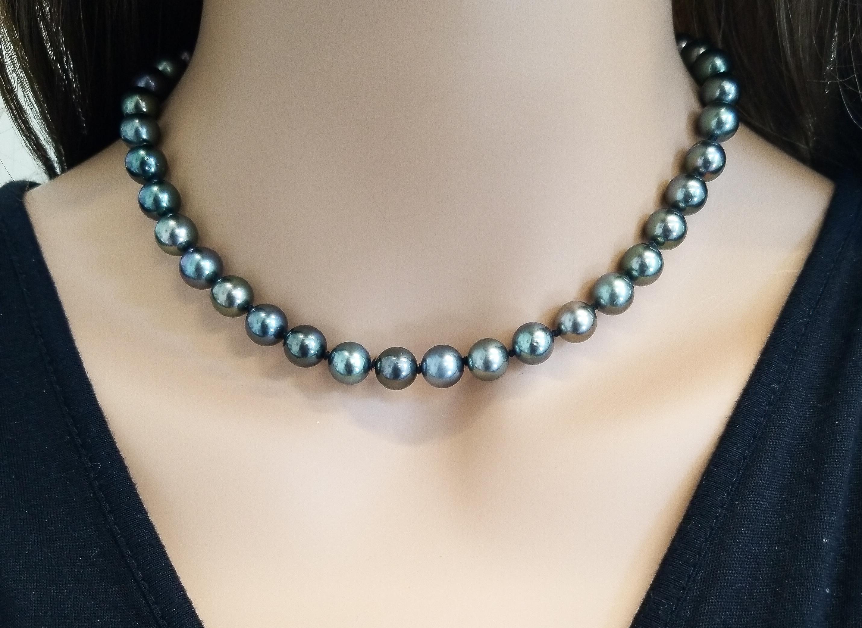 This necklace sets you apart from the crowd! It is brimming with style, elegance, and timeless sophistication. This extravagant Tahitian black pearl and diamond necklace delivers on panache and complexity and fastens securely with a 14 Karat diamond
