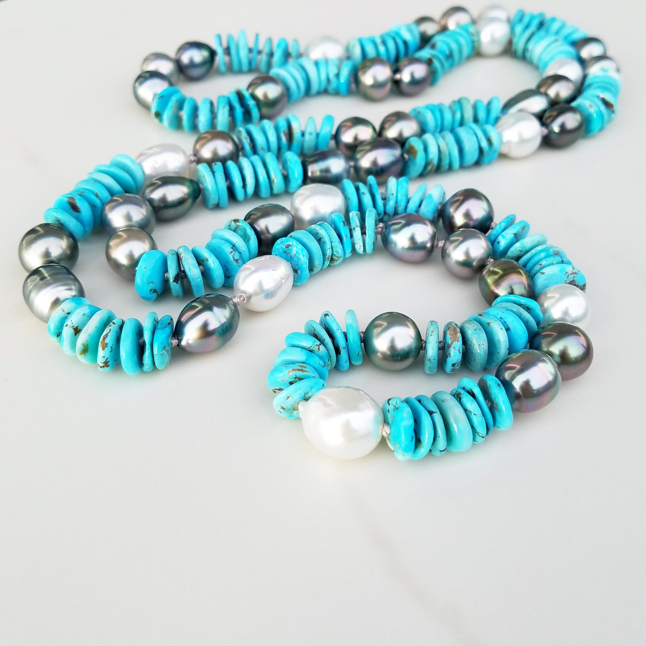Tahitian Black Pearls & South Sea White Pearls are mixed with Natural pale blue Turquoise in this exquisite mixture of sky and sea colors. 

32 Tahitian Pearls ranging from 11 mm to 13 mm in size & 10 South Sea Australian Pearls in sizes 11 mm to 13